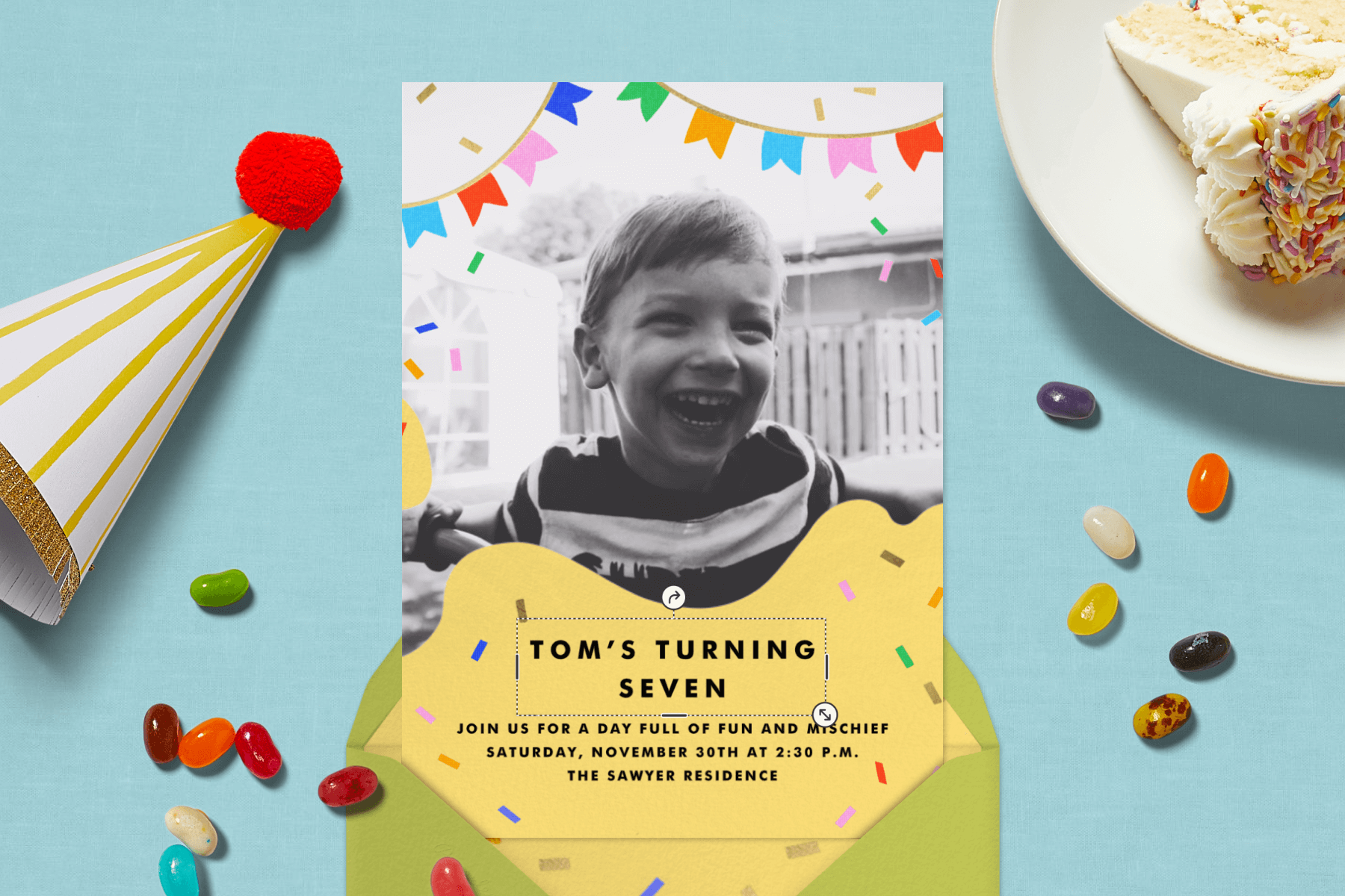 A kids’ birthday party invitation with banners over a photo, surrounded by festive items like a hat, a piece of cake, and jelly beans.