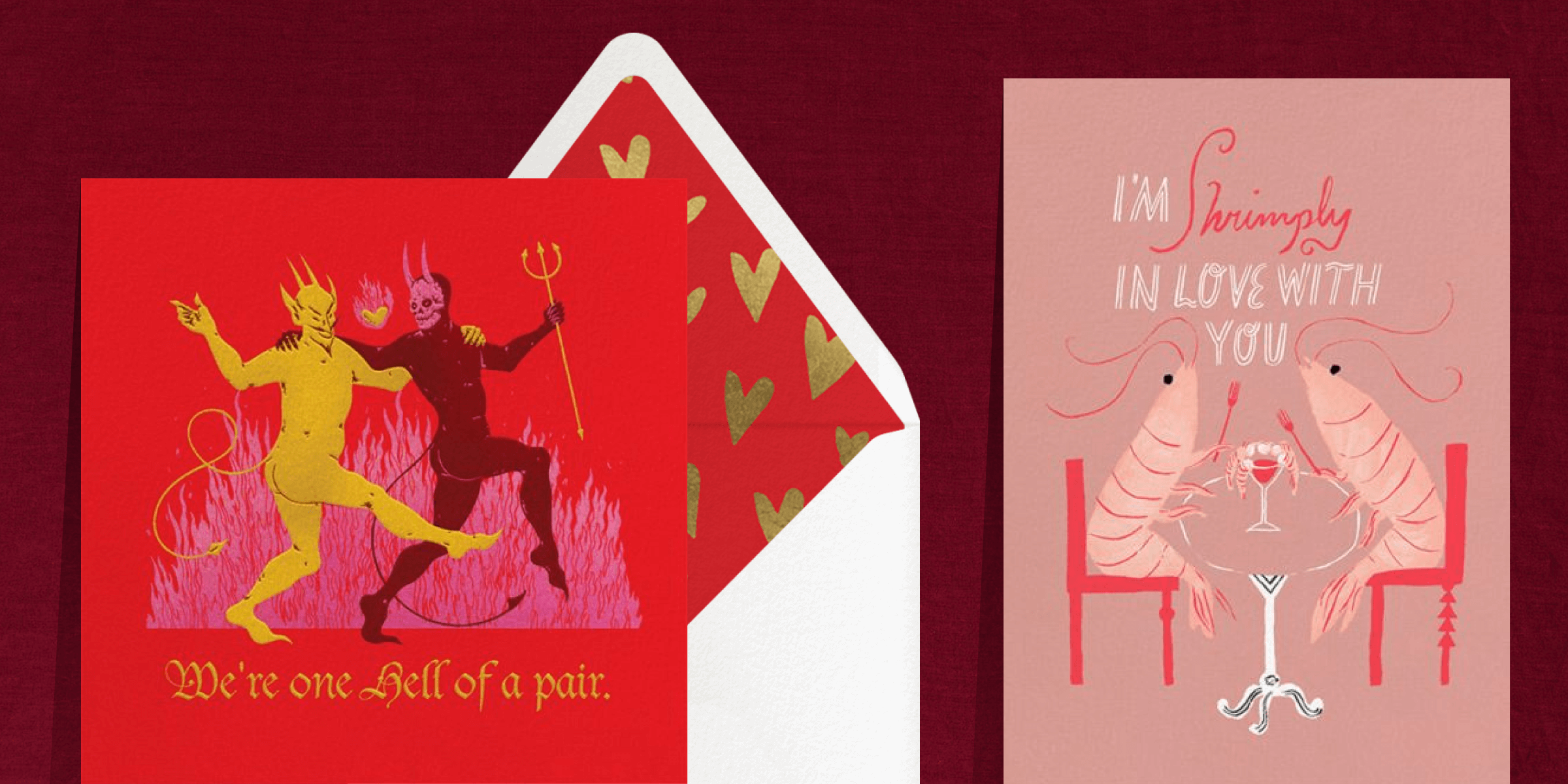 Two side-by-side Valentine’s Day cards. Left - A square red card featuring an illustration of two naked devils with their arms around each other with the phrase “we’re one hell of a pair.” Right - A pink card featuring an illustration of two shrimp dining together with the phrase “I’m shrimply in love with you.” The red card is paired with a white envelope with a red and gold heart liner.