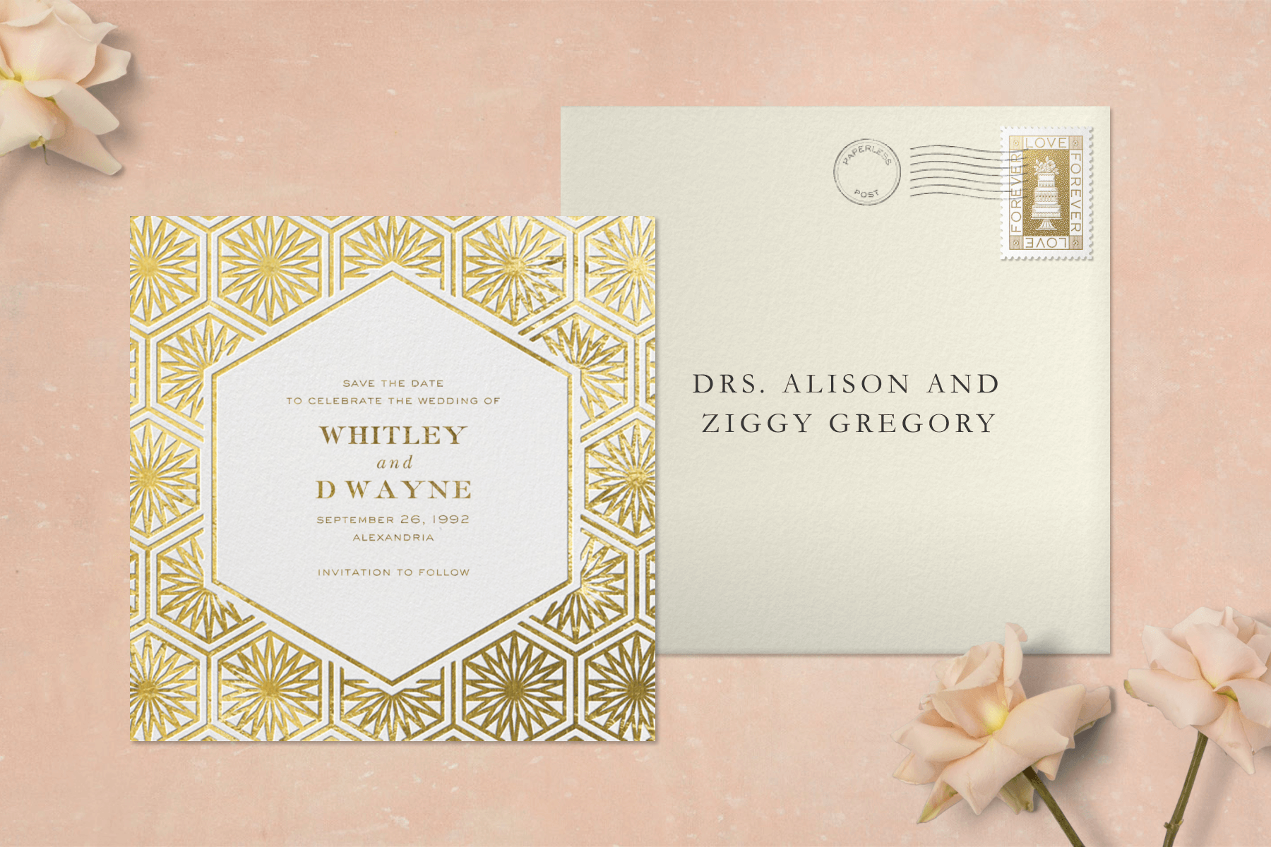 A square save the date card with a hexagonal border of gold sunburst shapes, beside a cream addressed envelope on a pale pink background with roses in two corners.