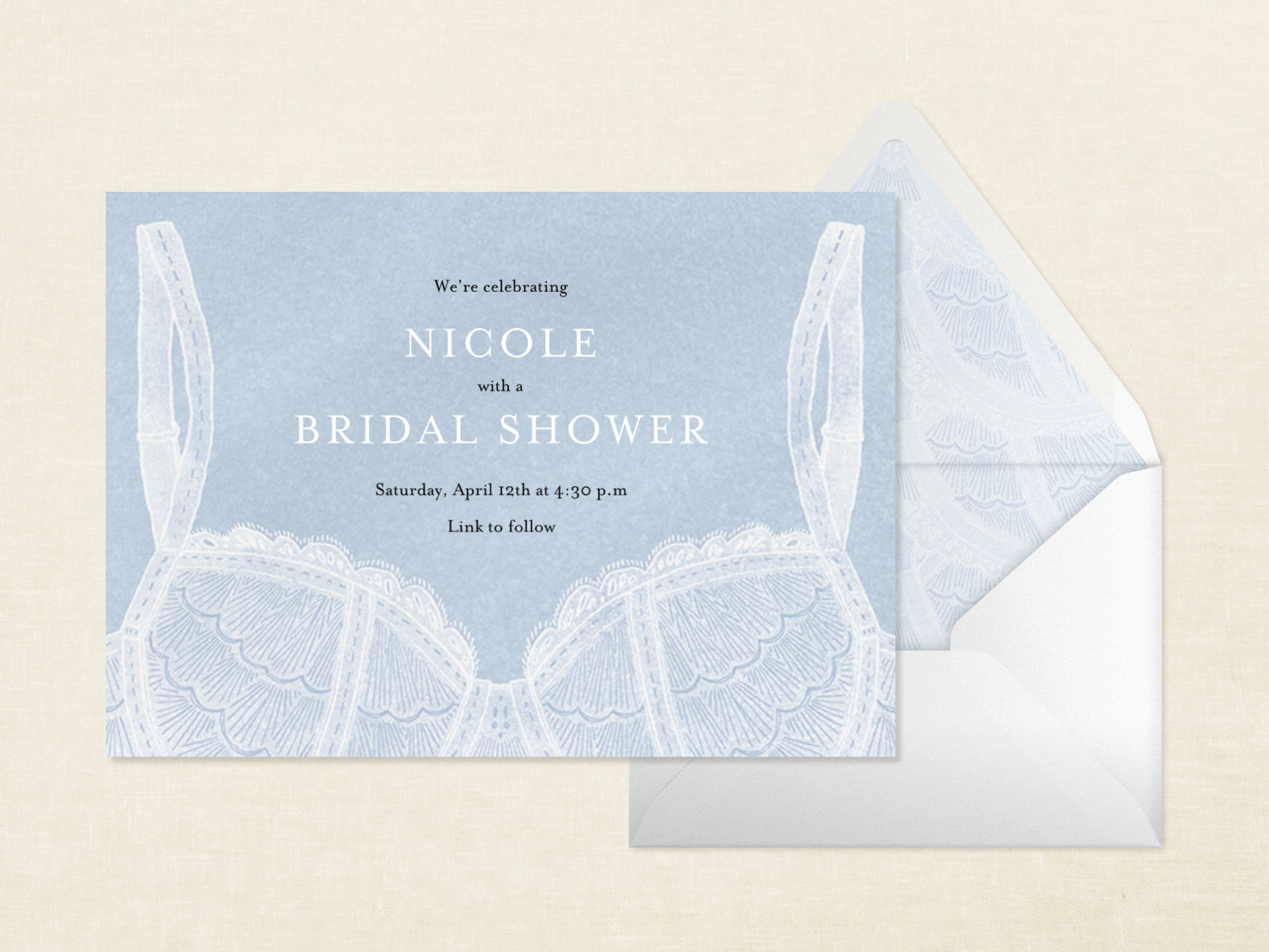 A horizontal virtual bridal shower invitation in baby blue with an illustration of a white lace bra, paired with a white envelope with a blue lace liner.