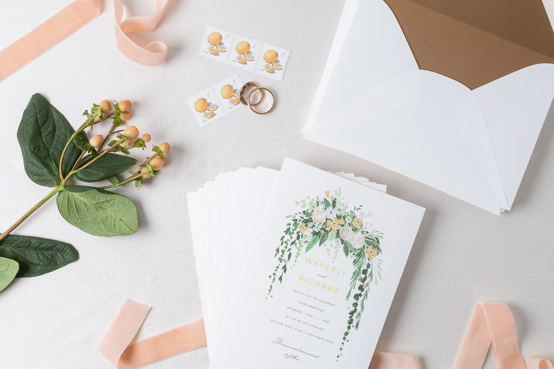 https://www.paperlesspost.com/blog/wp-content/uploads/01_Blog_PapersourceWeddingInvitationKeepsakeIdeas_StampsCardsAndEnvelopesStacked.png