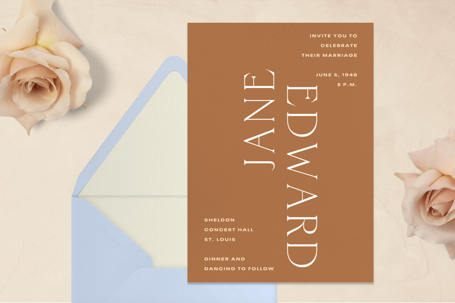 A burnt orange wedding invitation featuring the couple’s names in centered vertical typography.