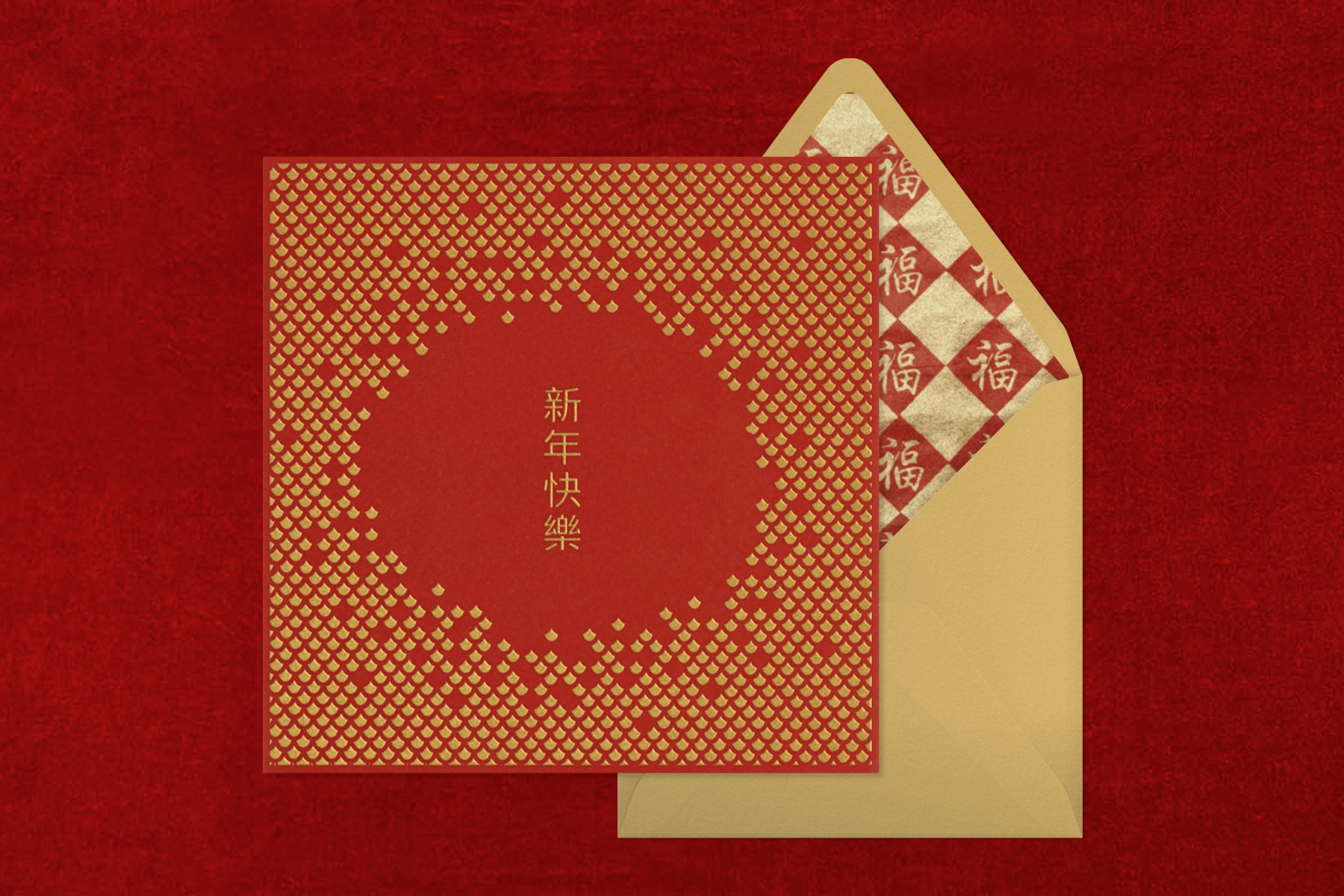 A red invitation with gold scales and Chinese characters with a gold envelope.