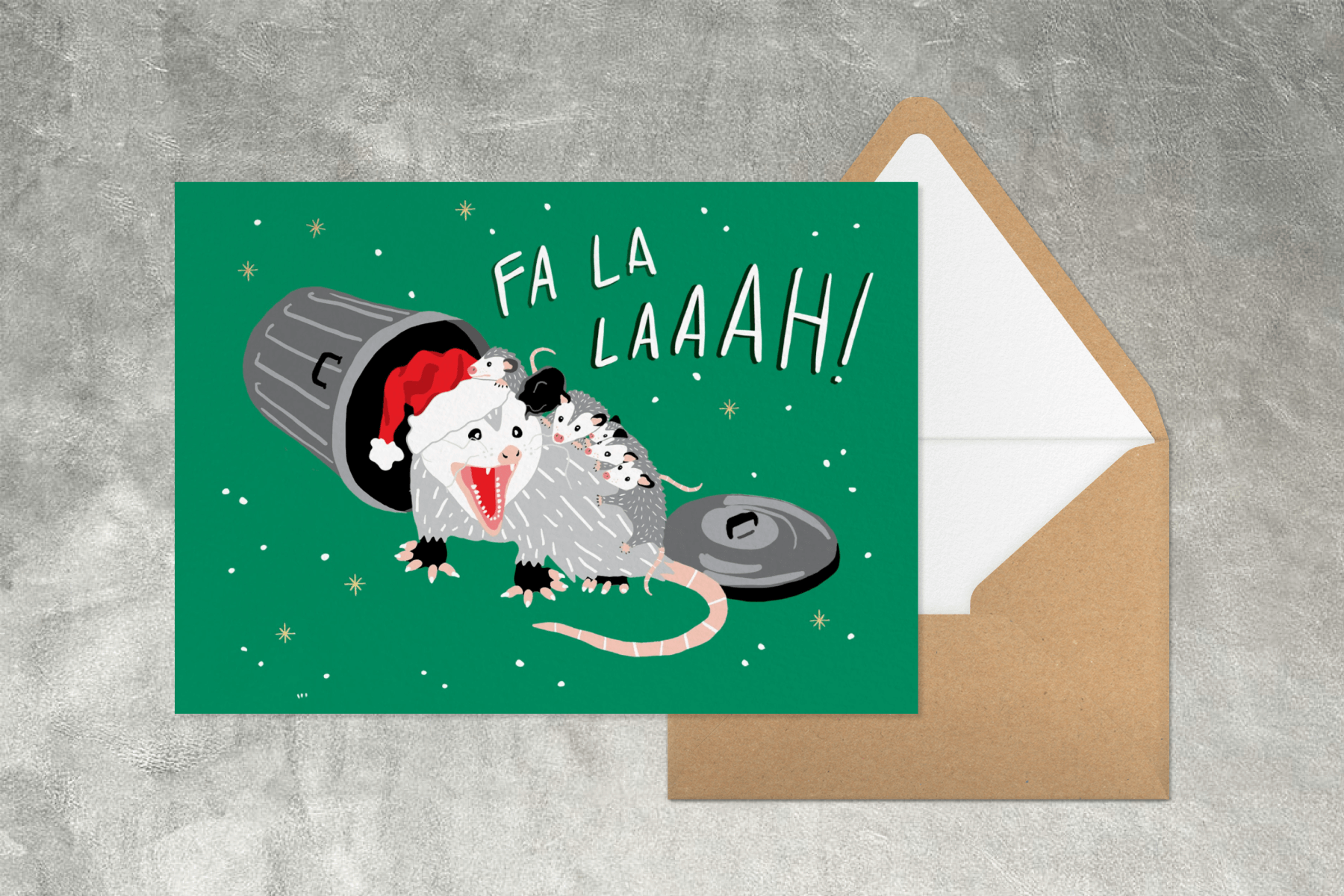 A green card with an opossum wearing a Santa hat and baby possums emerging from a trash can.