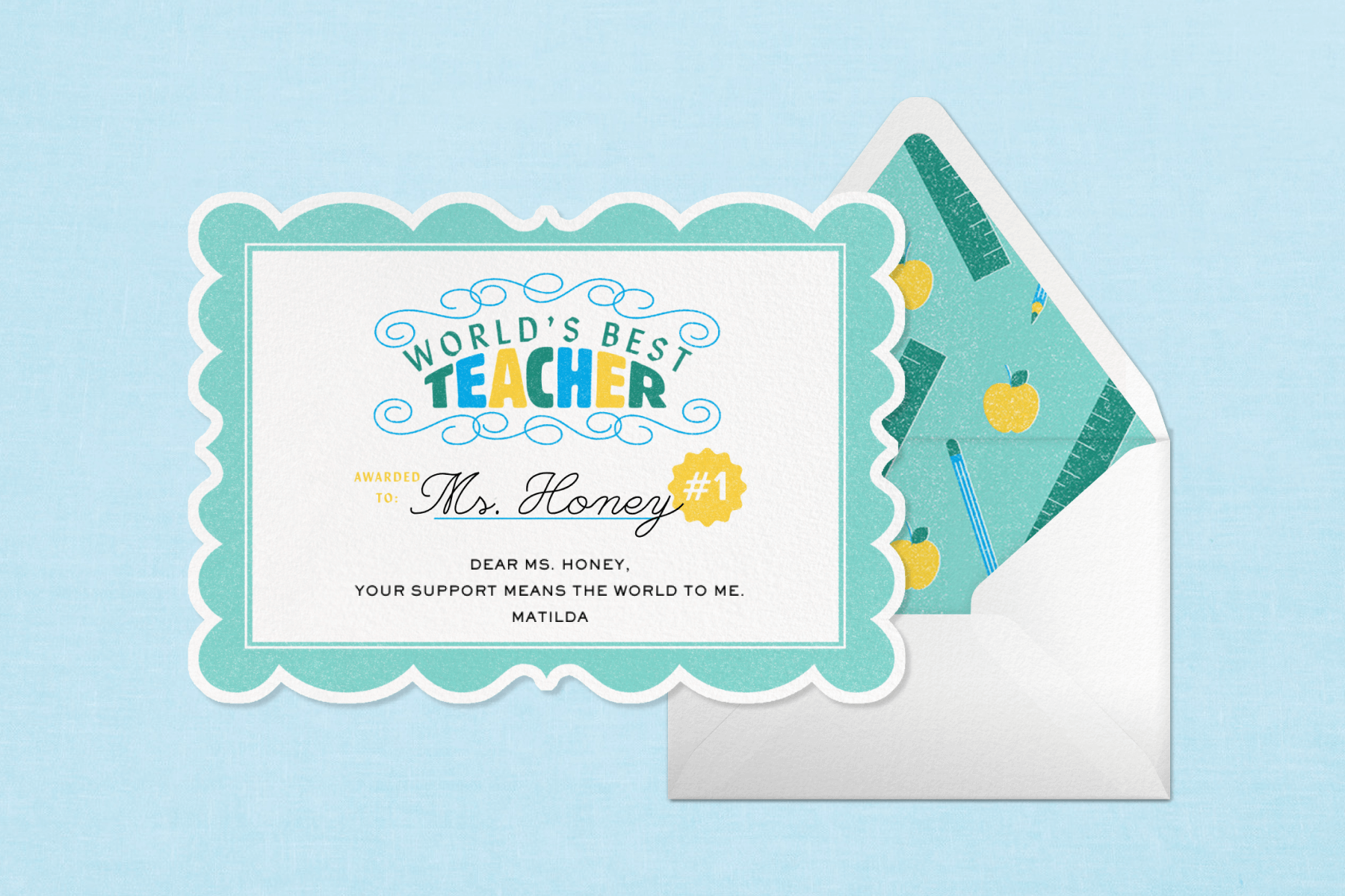 A card designed to look like a diploma reads WORLD’S BEST TEACHER beside an envelope with a school supply-themed liner.