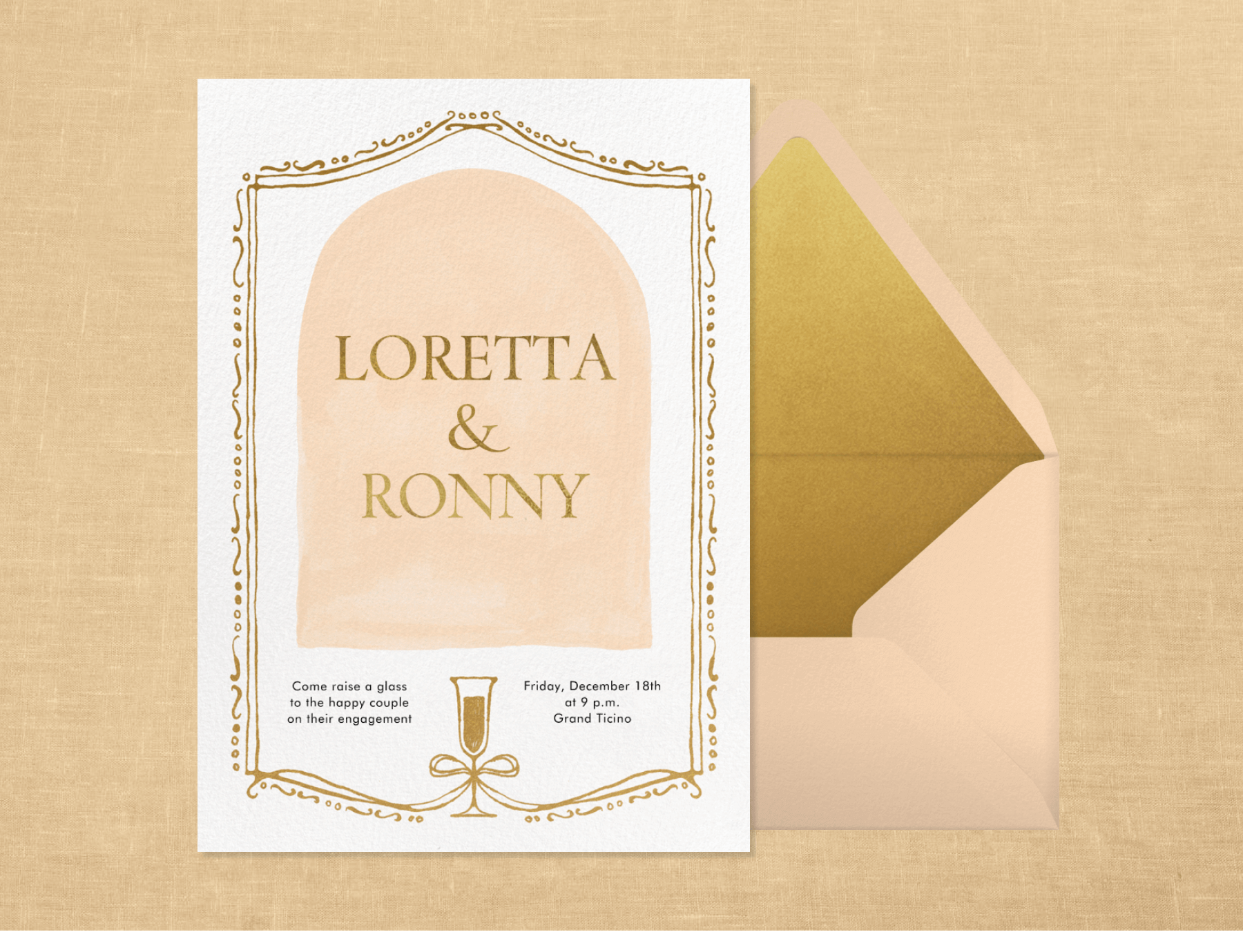 An engagement party invitation featuring a champagne glass and frame motif paired with a blush and gold envelope.