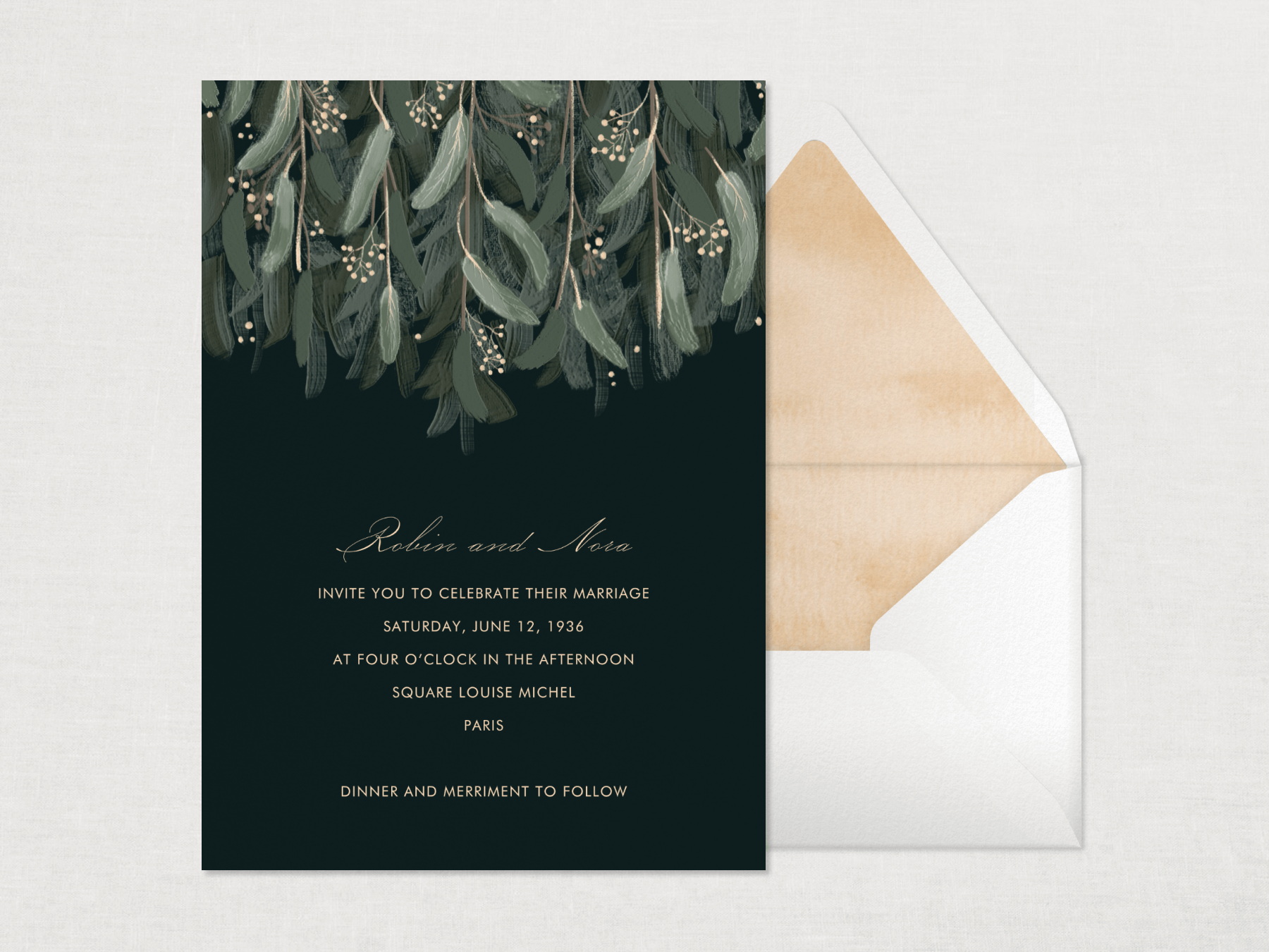 A black wedding invitation with silvery green leafy branches falling from the top.
