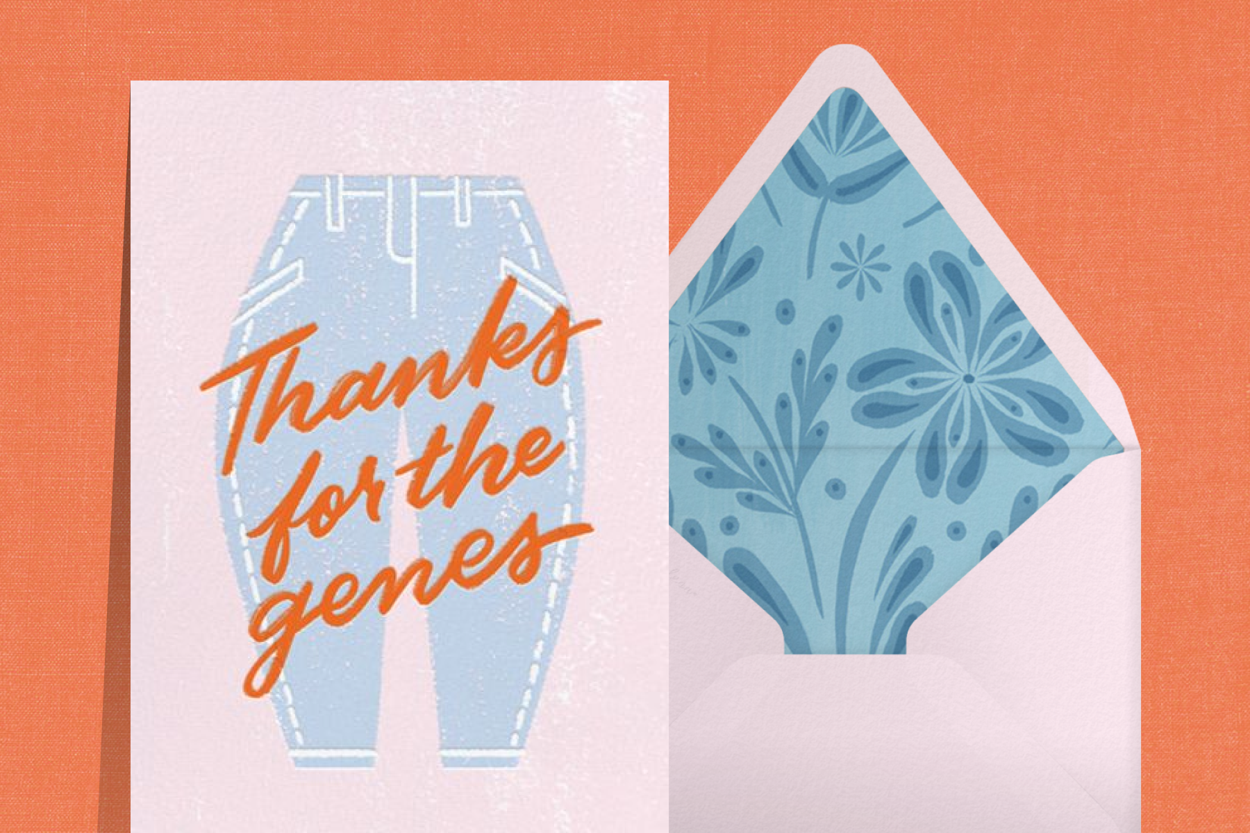 A Mother’s Day card that reads “Thanks for the genes” with an illustration of blue jeans, paired with a pink envelope with a blue floral liner.