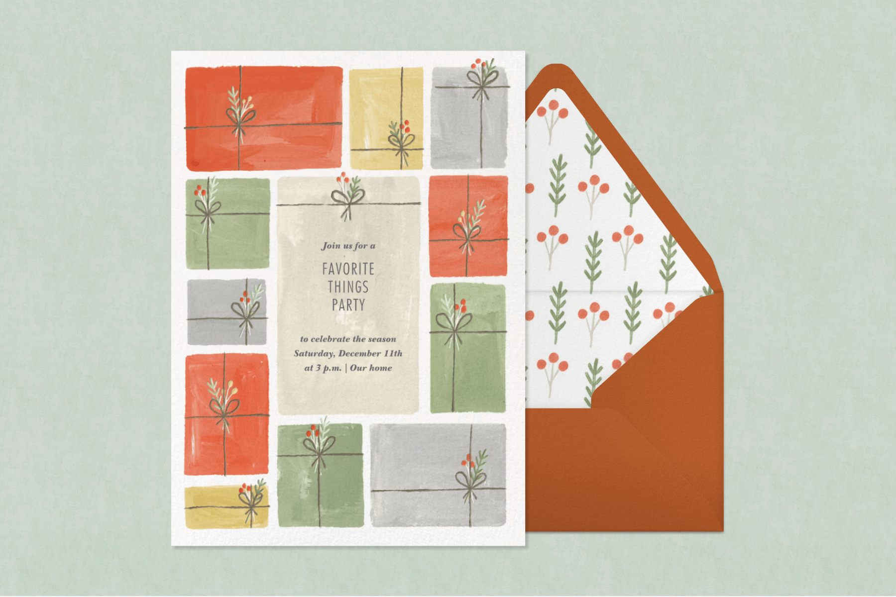 A favorite things party invitation featuring red, yellow, and green illustrated presents paired with a brown envelope, floral envelope liner, and light green background.