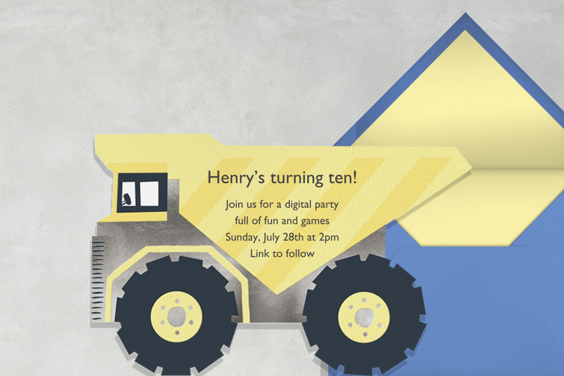 A birthday invitation shaped like a dump truck.