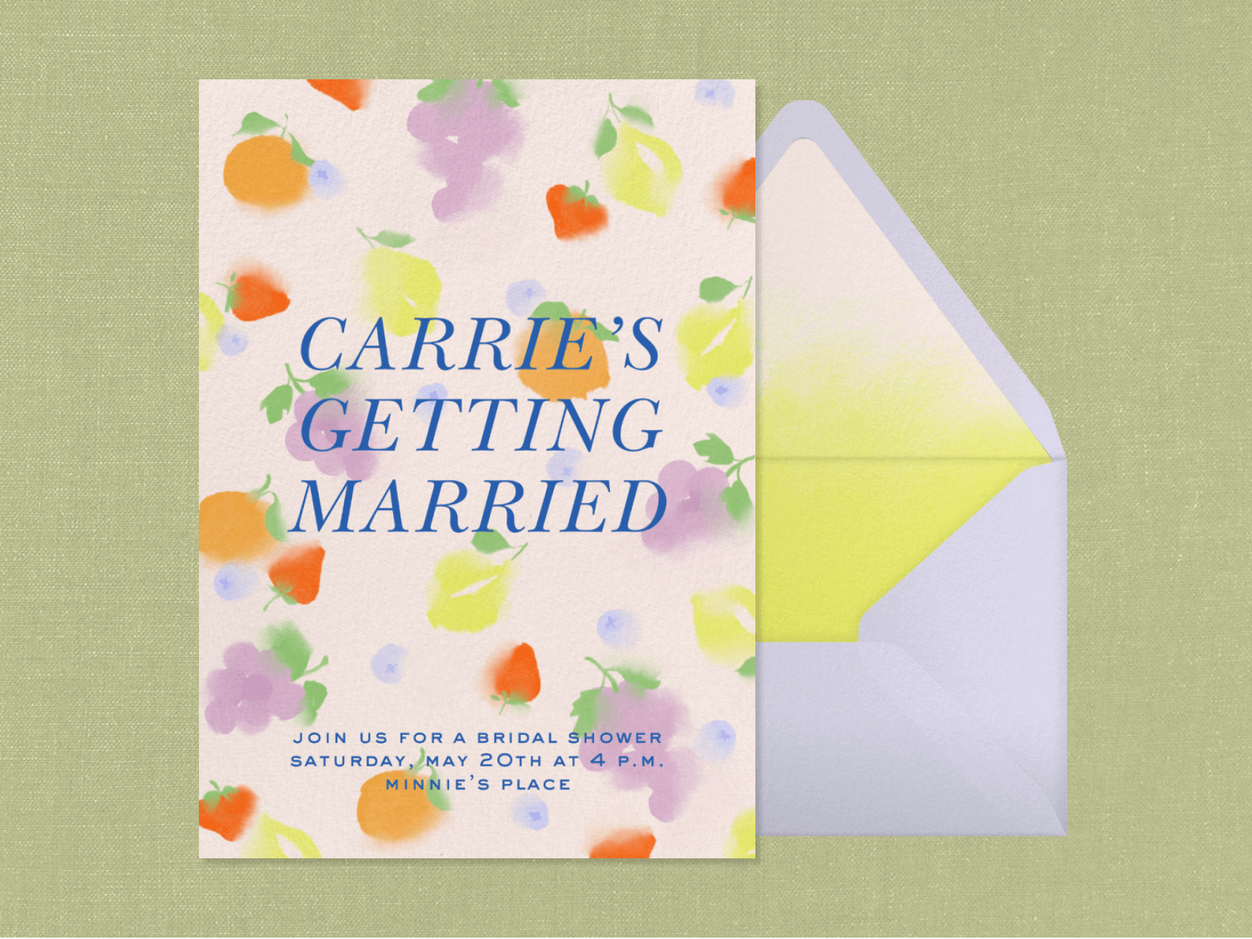 A bridal shower invitation with softly painted oranges, strawberries, grapes, lemons, and blueberries beside an envelope with faded yellow liner.