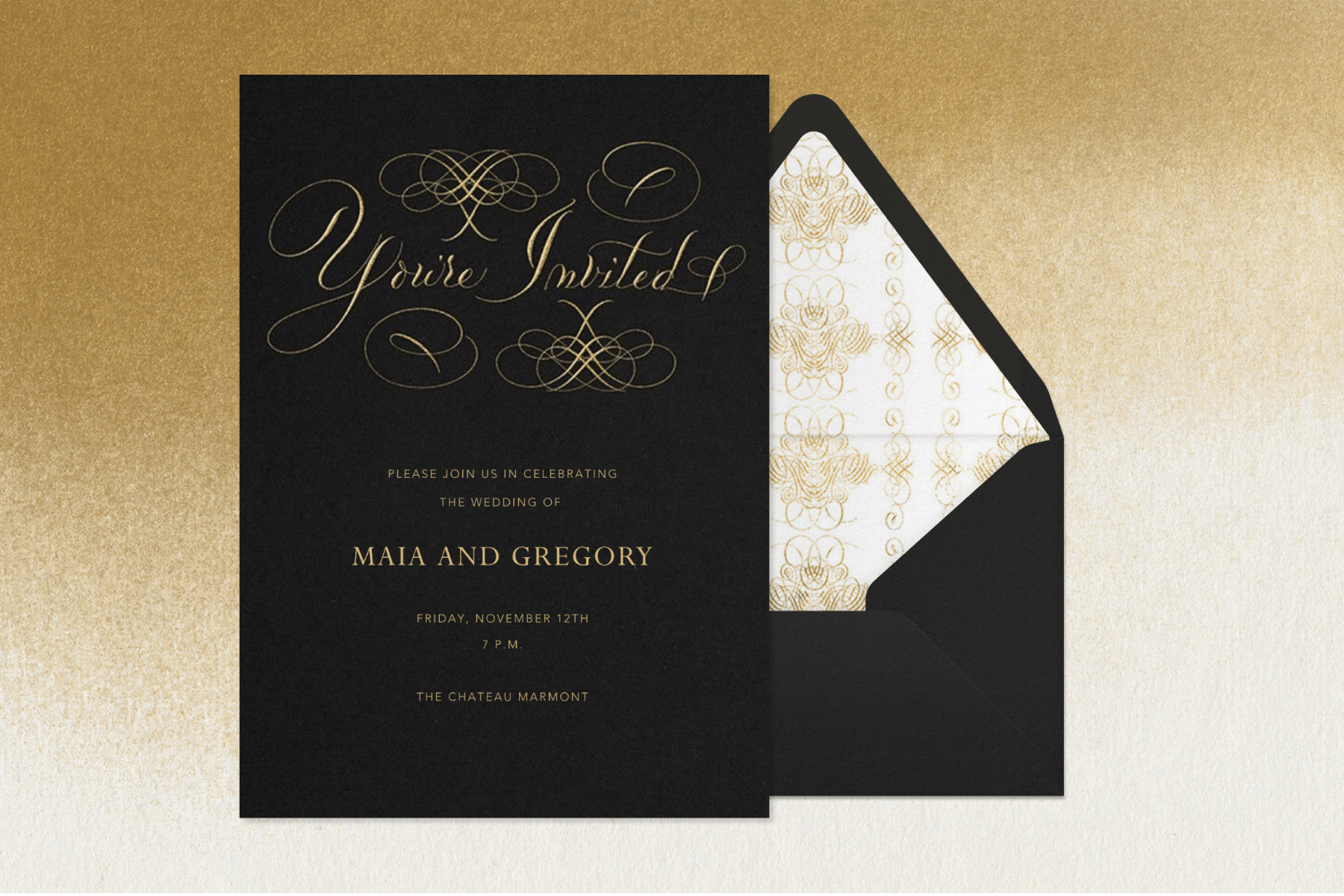 A black wedding invitation with gold and white lettering sits next to a matching envelope above a gradient gold and white backdrop.