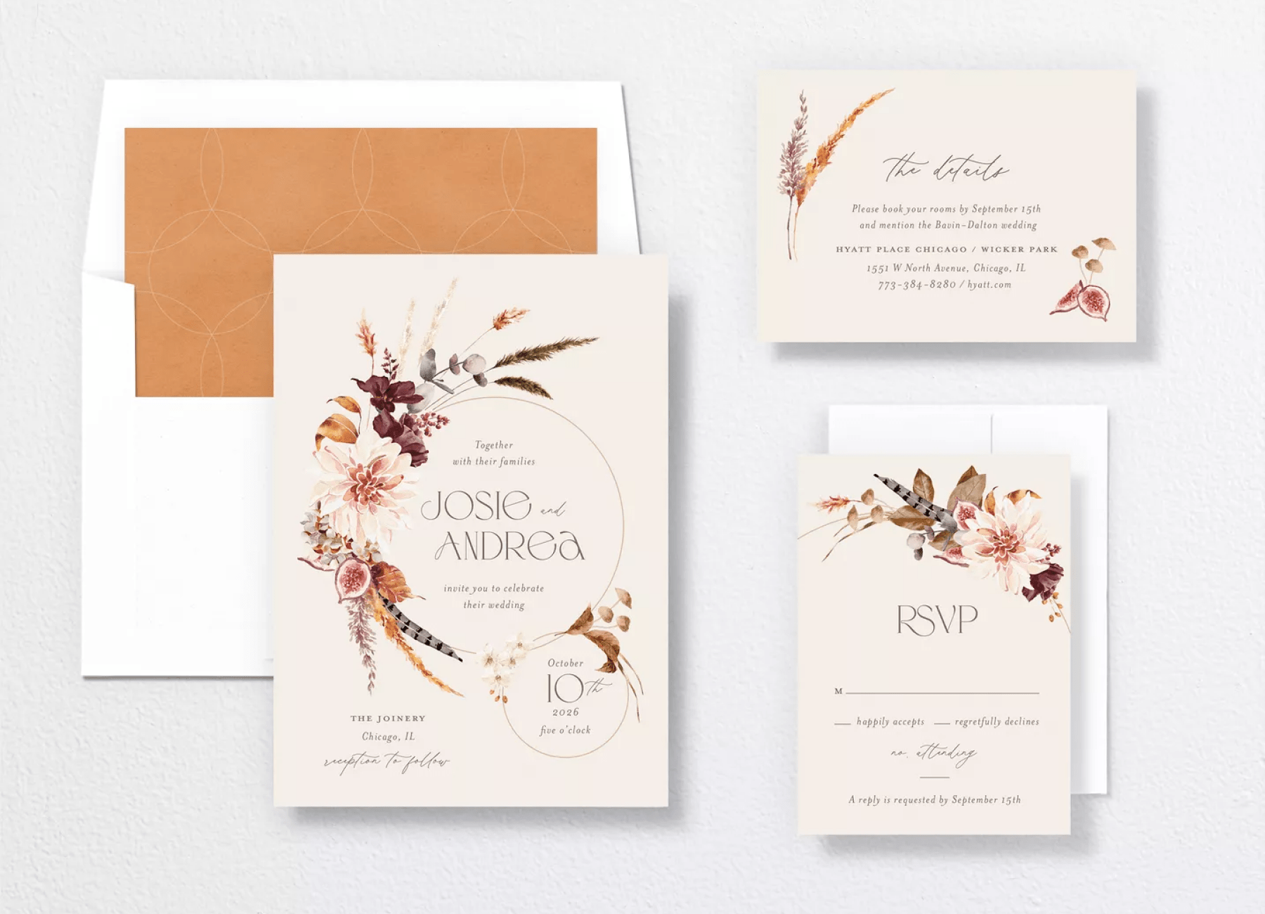 A wedding invitation with a hoop and delicate flower arrangement motif beside a matching details insert and RSVP card.