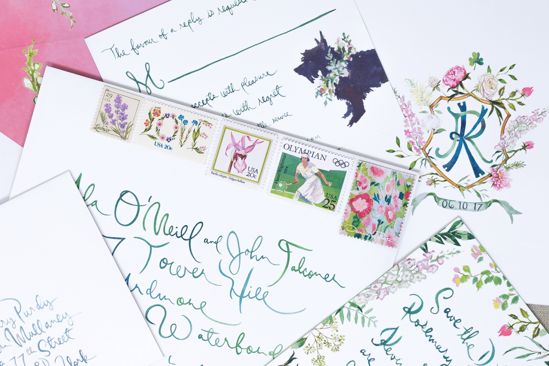 Details of a wedding invitation and envelope with hand-written words and address in ombre green and blue, with a Scottish terrier, floral crest, and several decorative stamps.