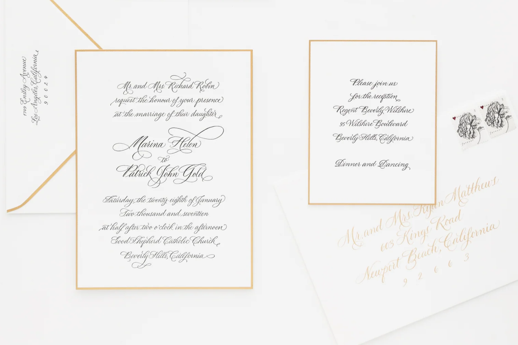 A wedding invitation suite with the details in cursive font and simple gold border.