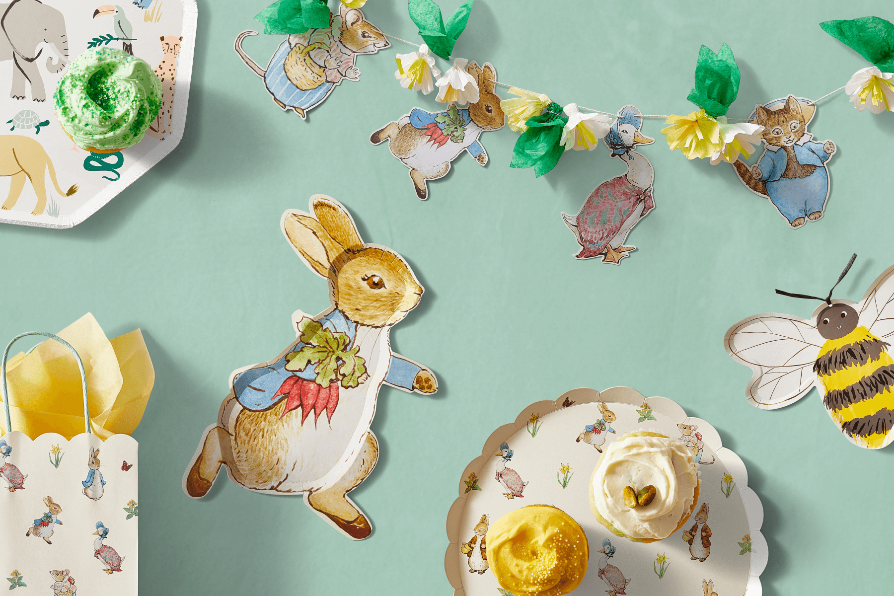 Peter Rabbit-themed party plates and banners.