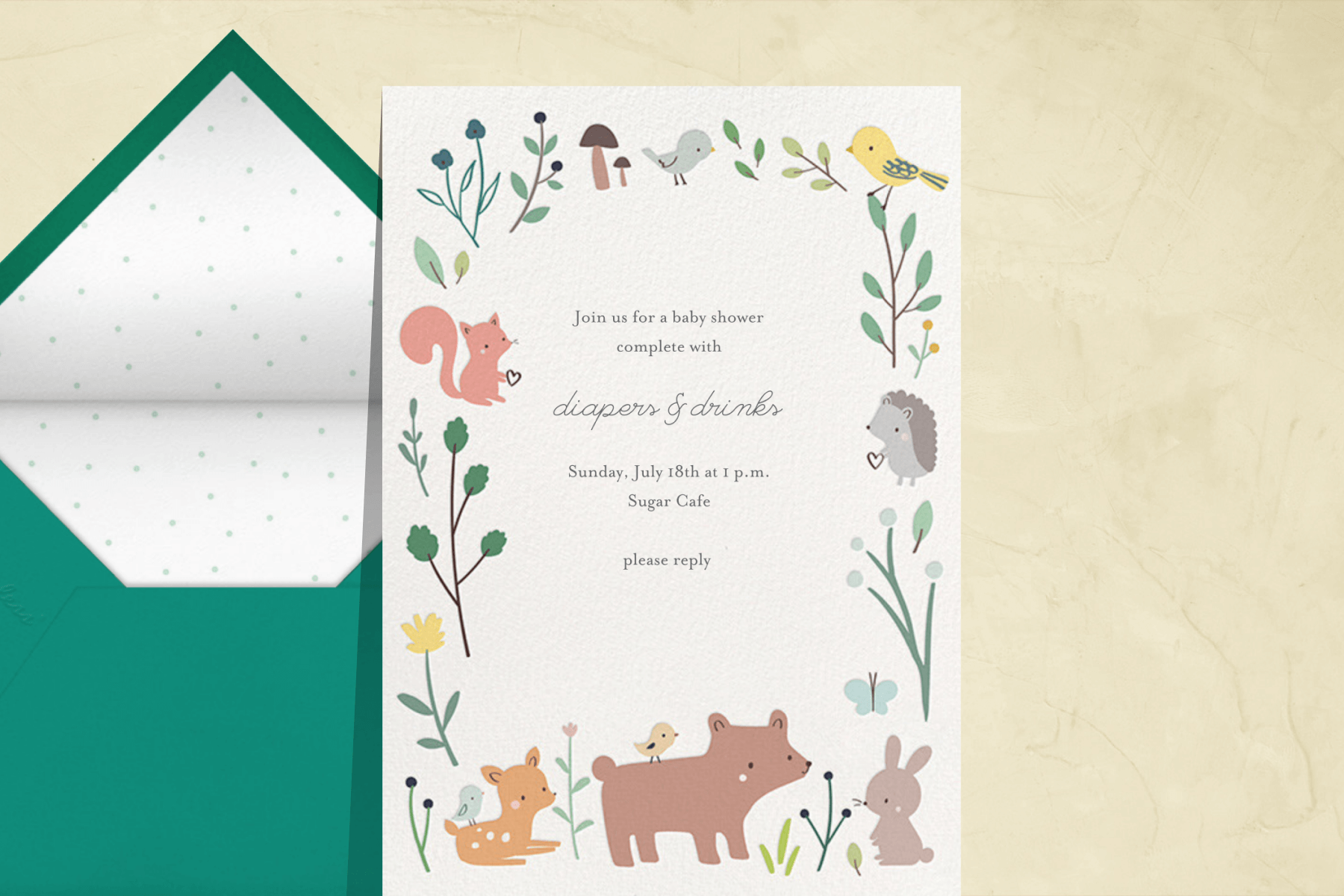 A baby shower invitation with illustrated baby woodland creatures