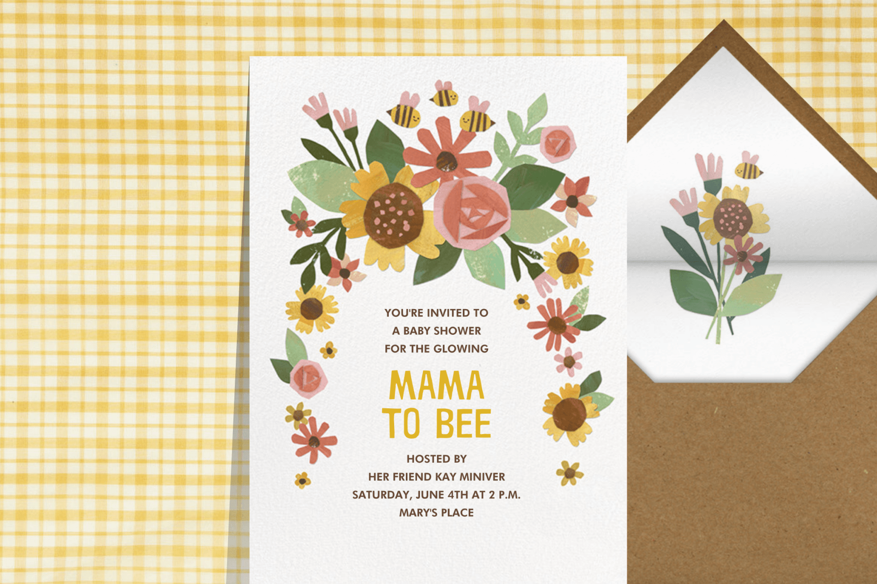 A baby shower invitation with paper cutout florals and bumblebees