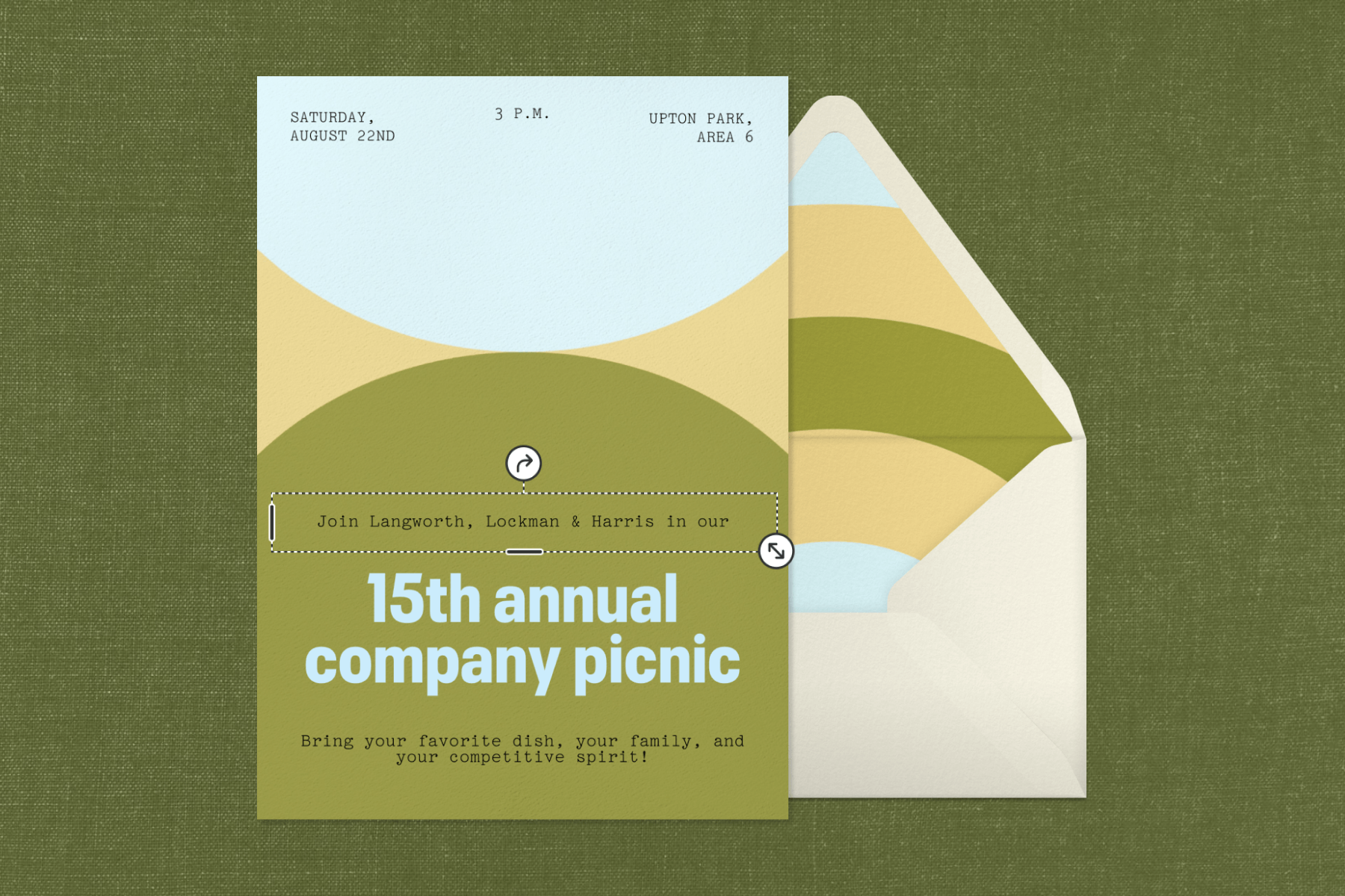 An invitation with large rounded shapes in green, light blue, and yellow, beside an envelope with matching liner.