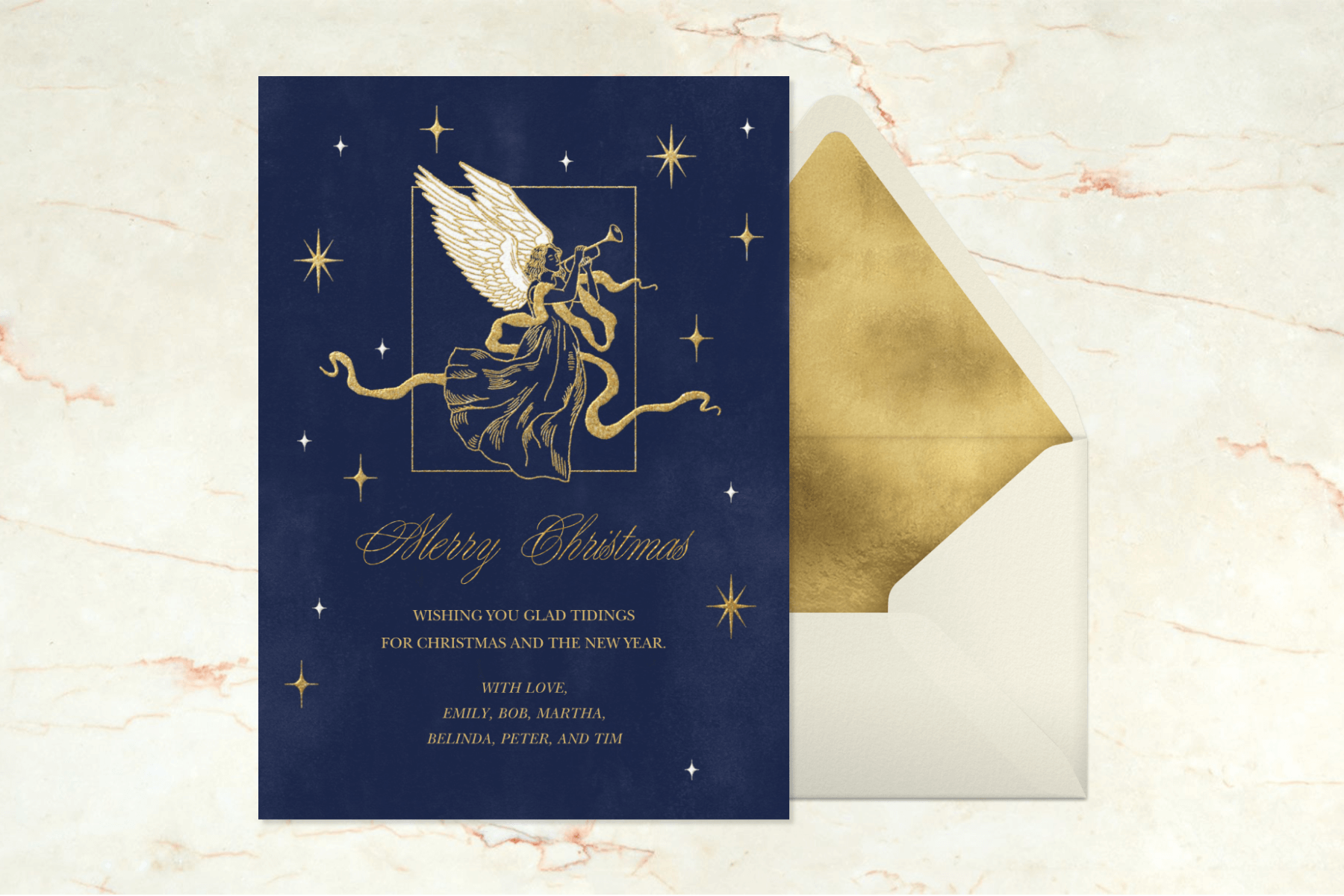 A navy blue card with a gold angel blowing a horn surrounded by stars.
