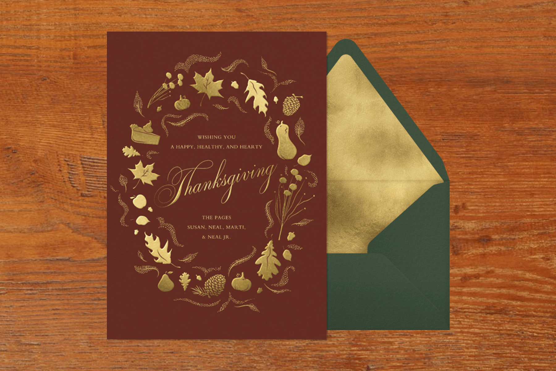 A brown and gold Thanksgiving card with fall-themed illustrations like pie, leaves, and pine cones.