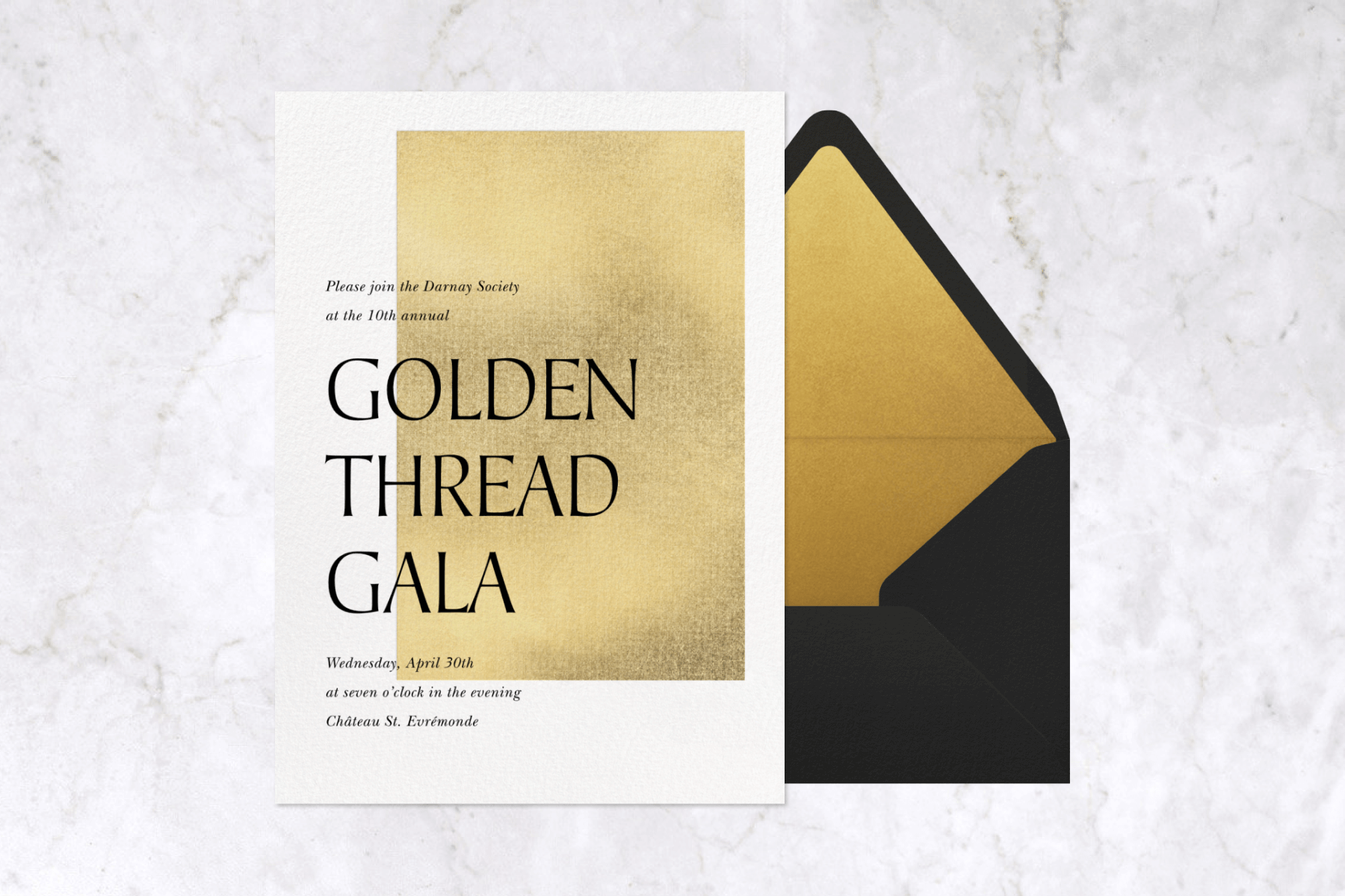 An invitation for the “Golden Thread Gala” has an off-center gold rectangle behind the text, and a black envelope with gold liner.