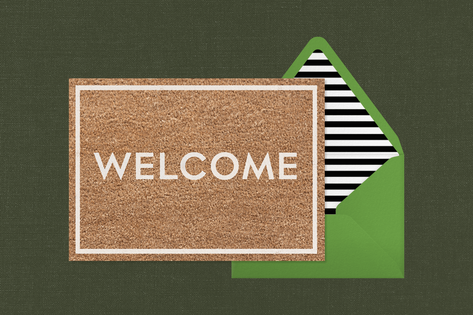 A card that resembles a coir doormat with the word “Welcome” in white block letters, beside a green envelope with black and white striped liner.