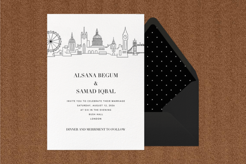 An invitation with a simple illustration of the London skyline beside a black envelope with spot liner.