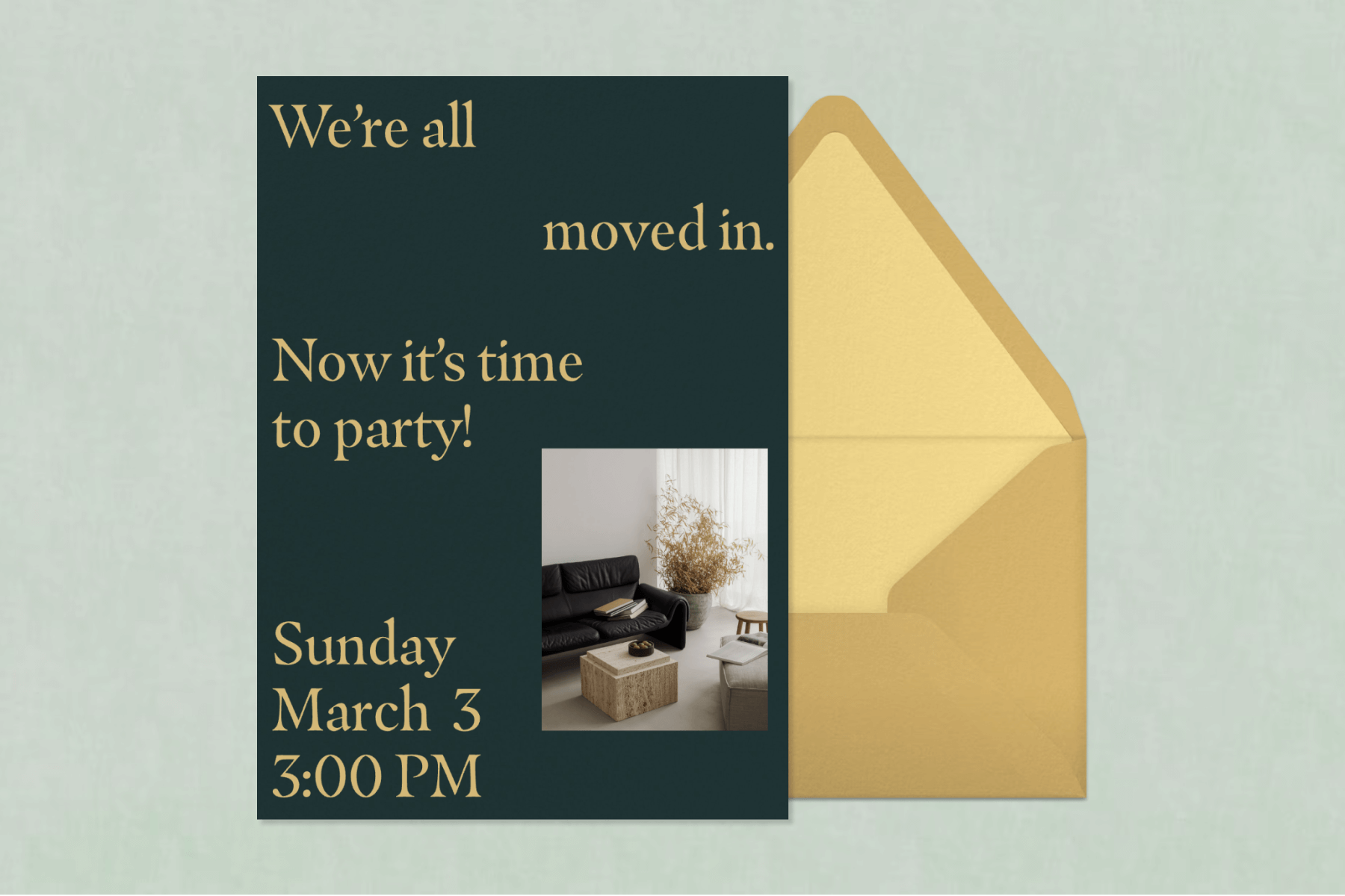 A dark green invitation for a housewarming party featuring a photo of a living room and yellow text, plus a gold envelope and yellow envelope liner.