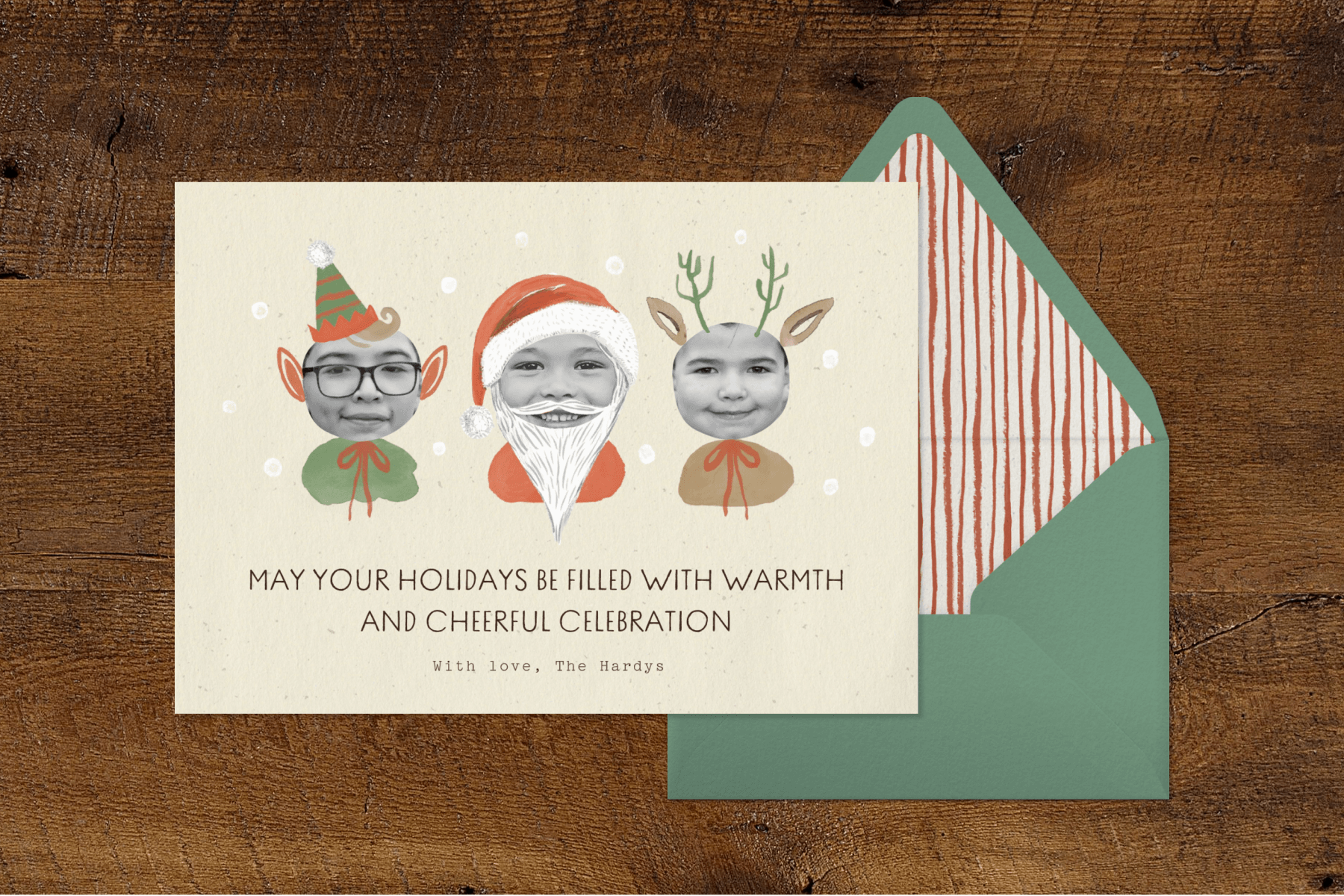 A card with photos of three children with illustrations to make them look like an elf, Santa Claus, and a reindeer.