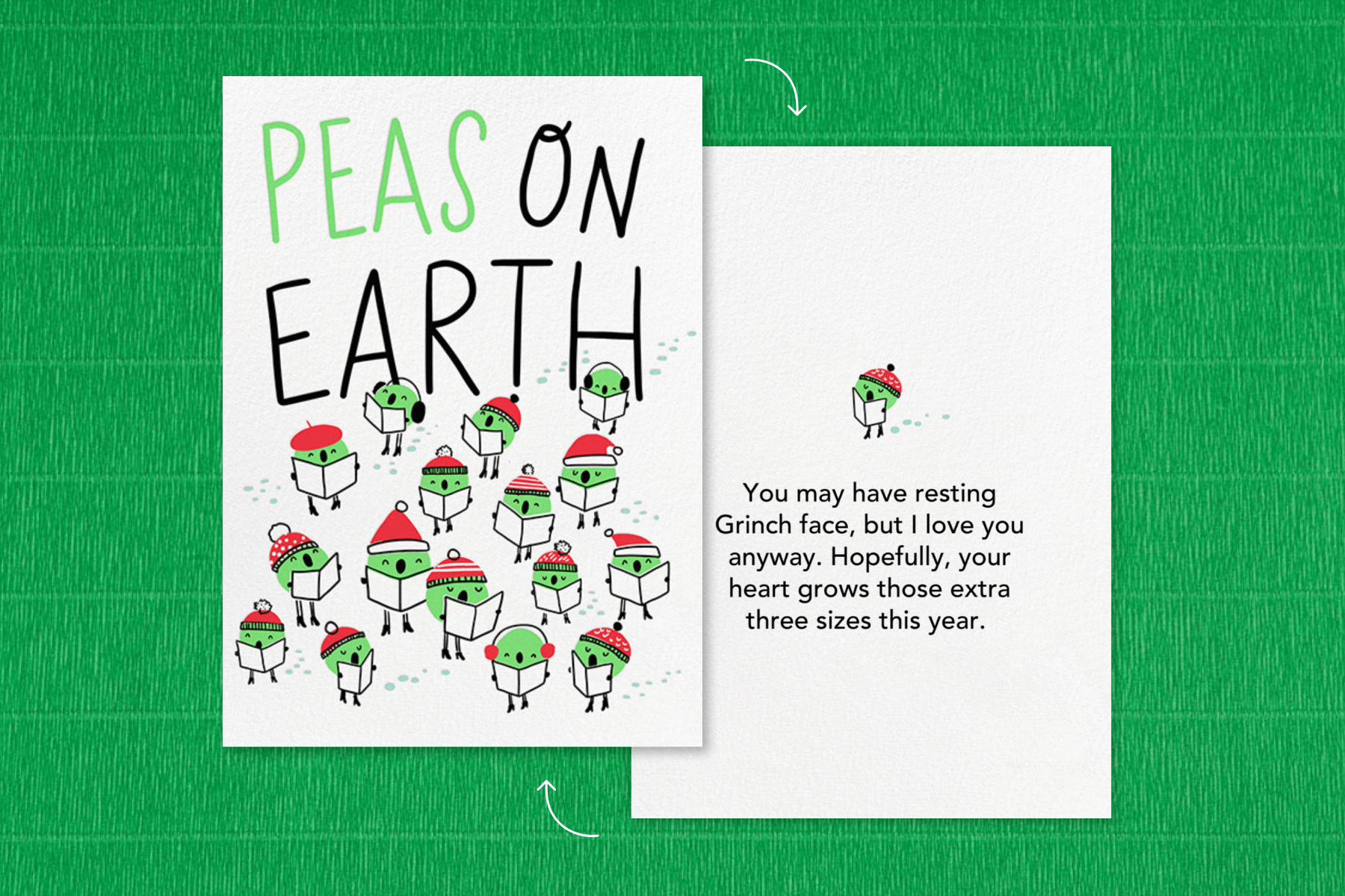 A card with green peas caroling in red winter hats and the phrase “Peas on Earth.”