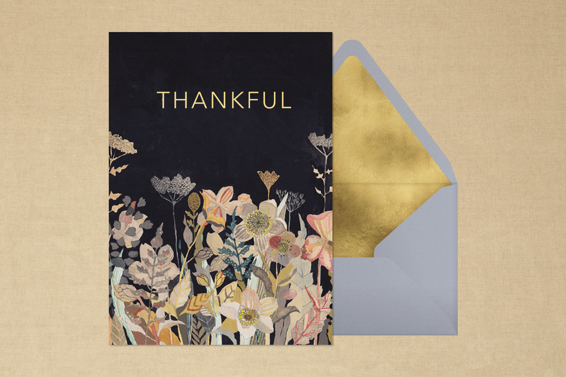 A black thank you card with illustrations of pastel flowers and the word “Thankful.”