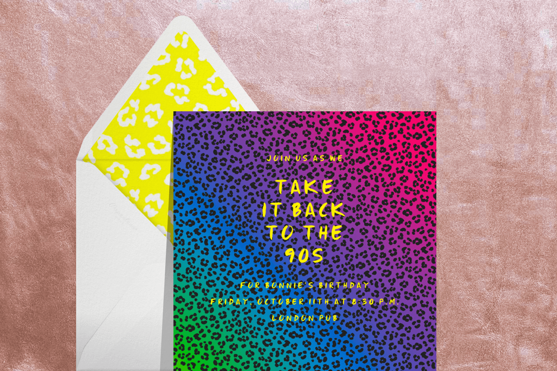 An invitation with rainbow cheetah print background.