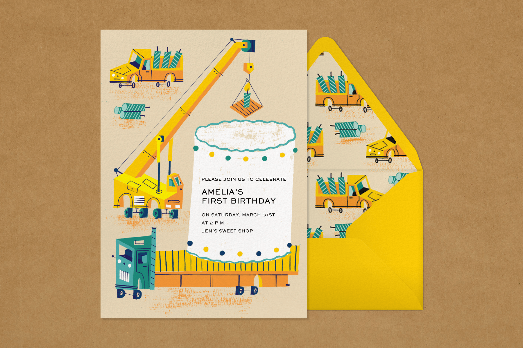 A birthday invitation reads “Amelia’s first birthday” with illustrations of orange trucks and cranes placing a candle atop a giant white cake.