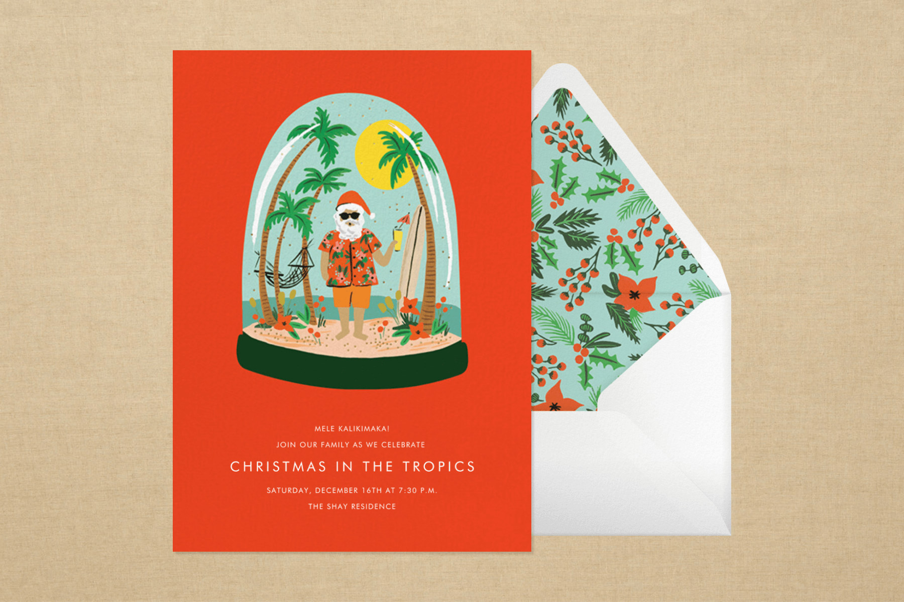 A red card with a snow globe featuring Santa in tropical garb on a beach.