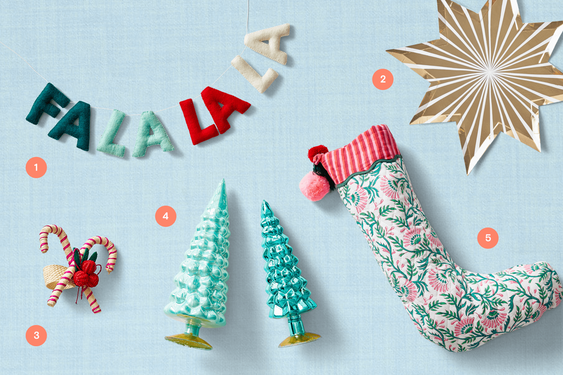 Christmas decorations, party supplies, and a stocking on a blue backdrop. 