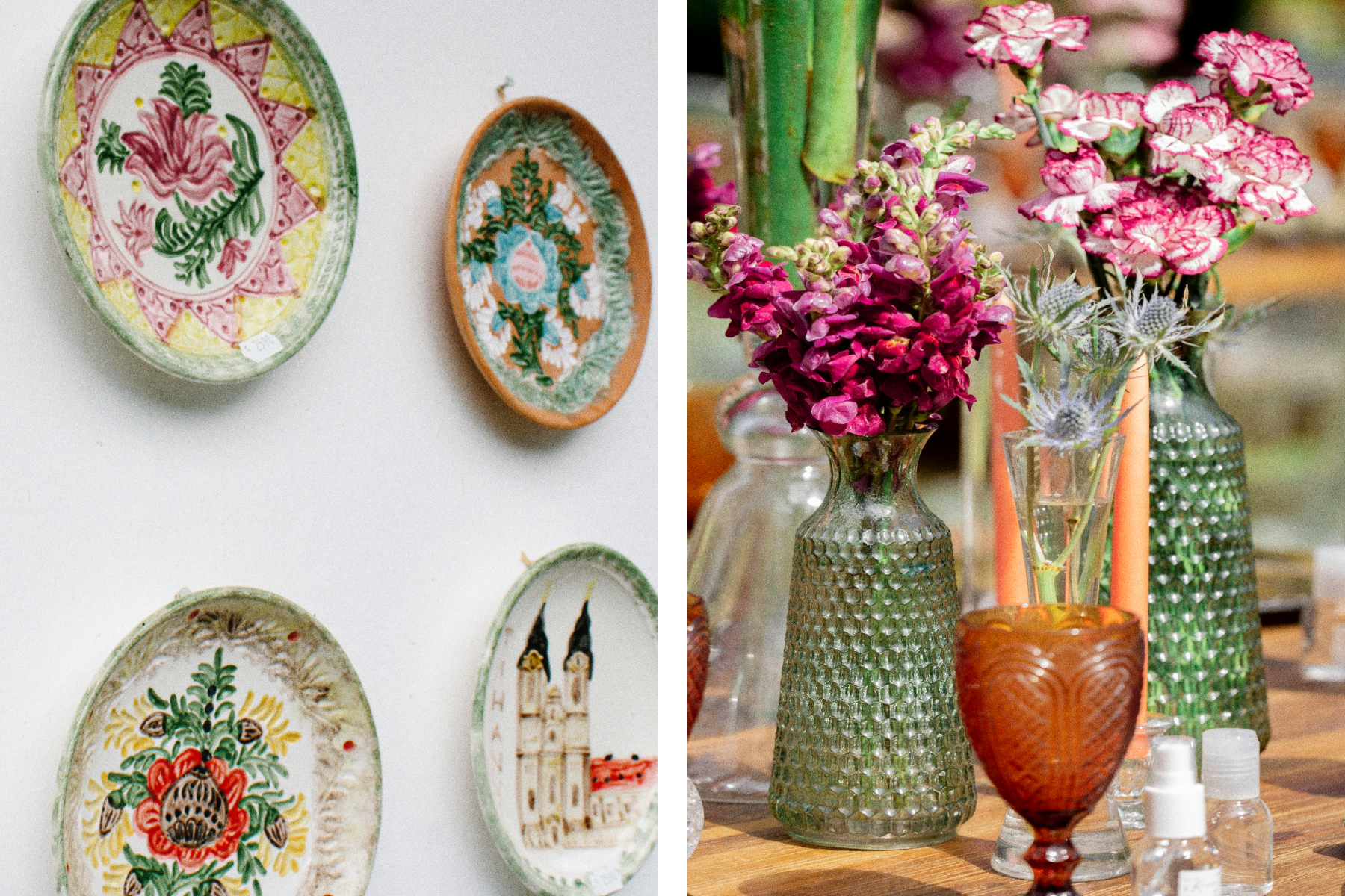 Left: A white wall decorated with four hanging plates with colorful illustrations. Right: Green, clear, and burnt orange vases filled with pink and white flowers. 