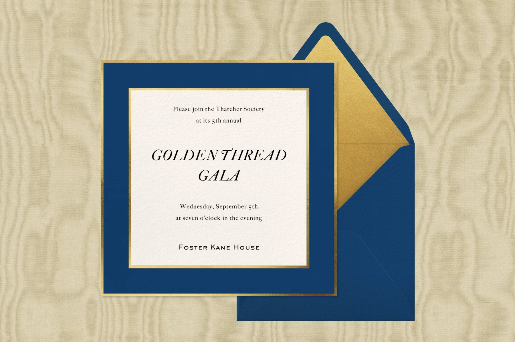 A square gala invitation with a dark blue and gold border, next to a dark blue envelope, over a gold wood-grain style background.
