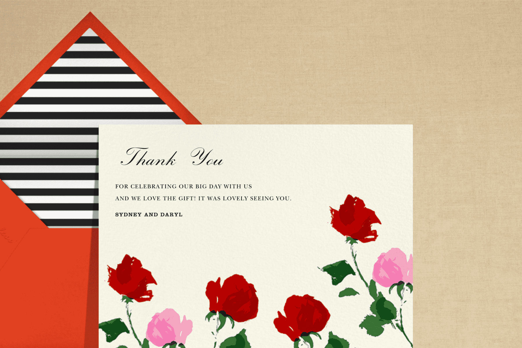 A thank you card with pink and red roses growing from the bottom.