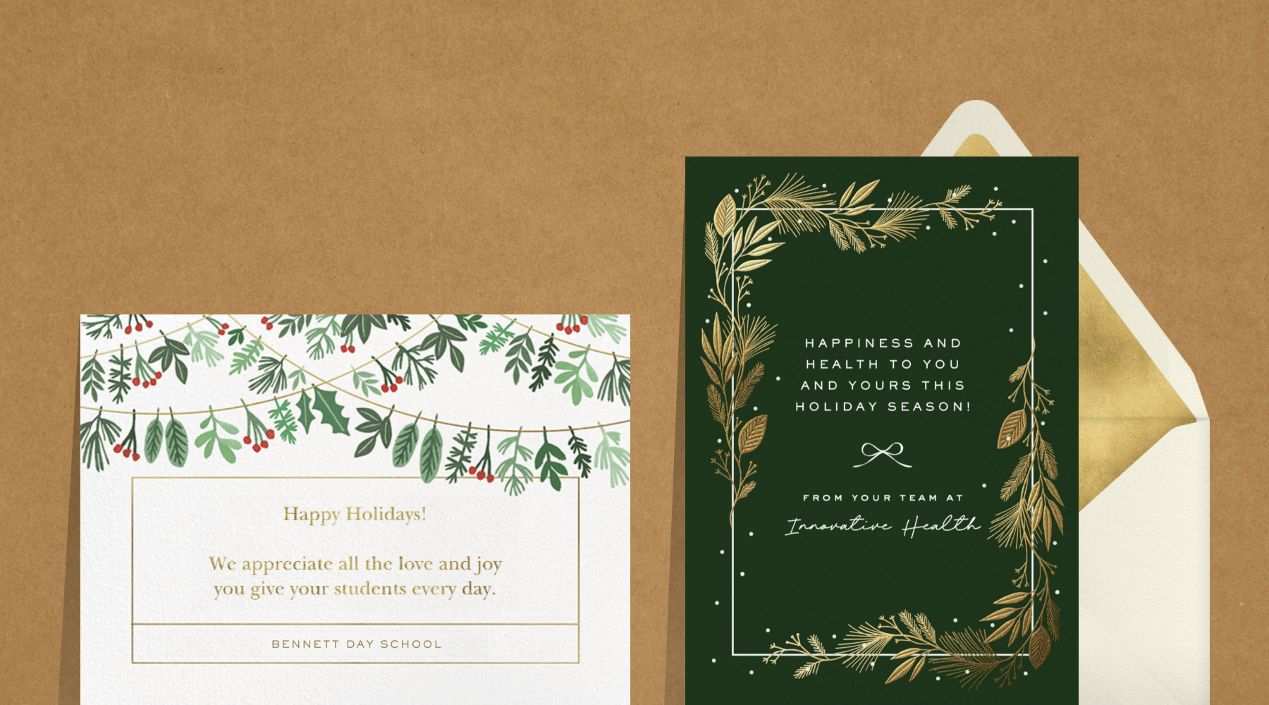 A white holiday card with holly leaves, berries, and sprigs hanging from draped lines; A forest green card with a border of gold winter greenery.