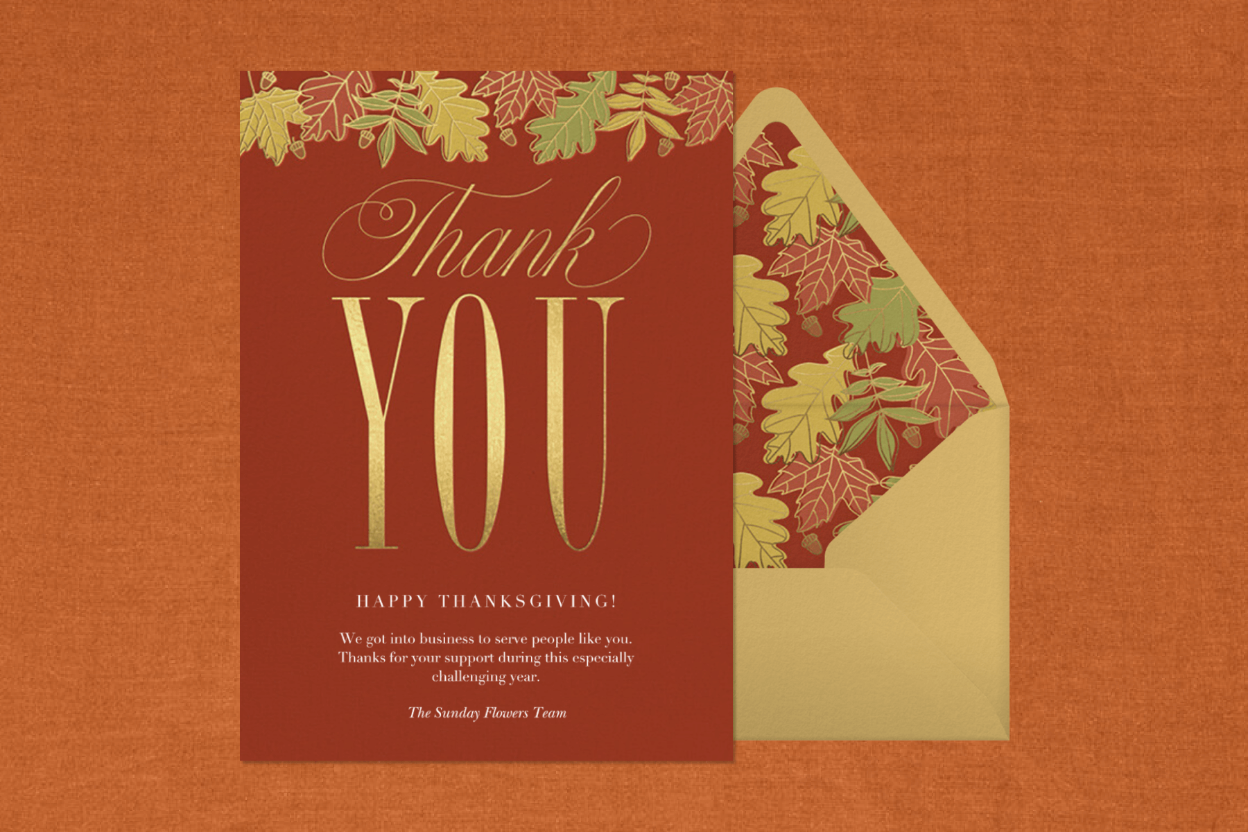 A brown thank you card with a fall foliage motif.