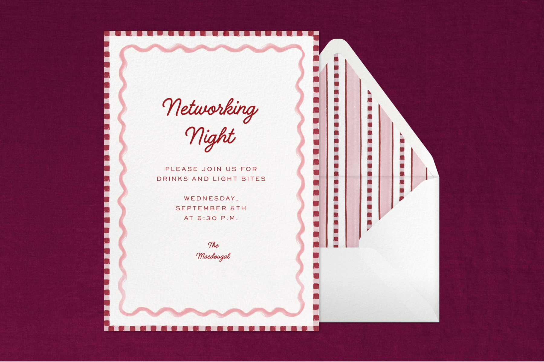  An invitation to a networking night with a burgundy striped edge and a pink squiggly border, on top of a white envelope with a striped liner, on top of a deep purple fabric backdrop. 