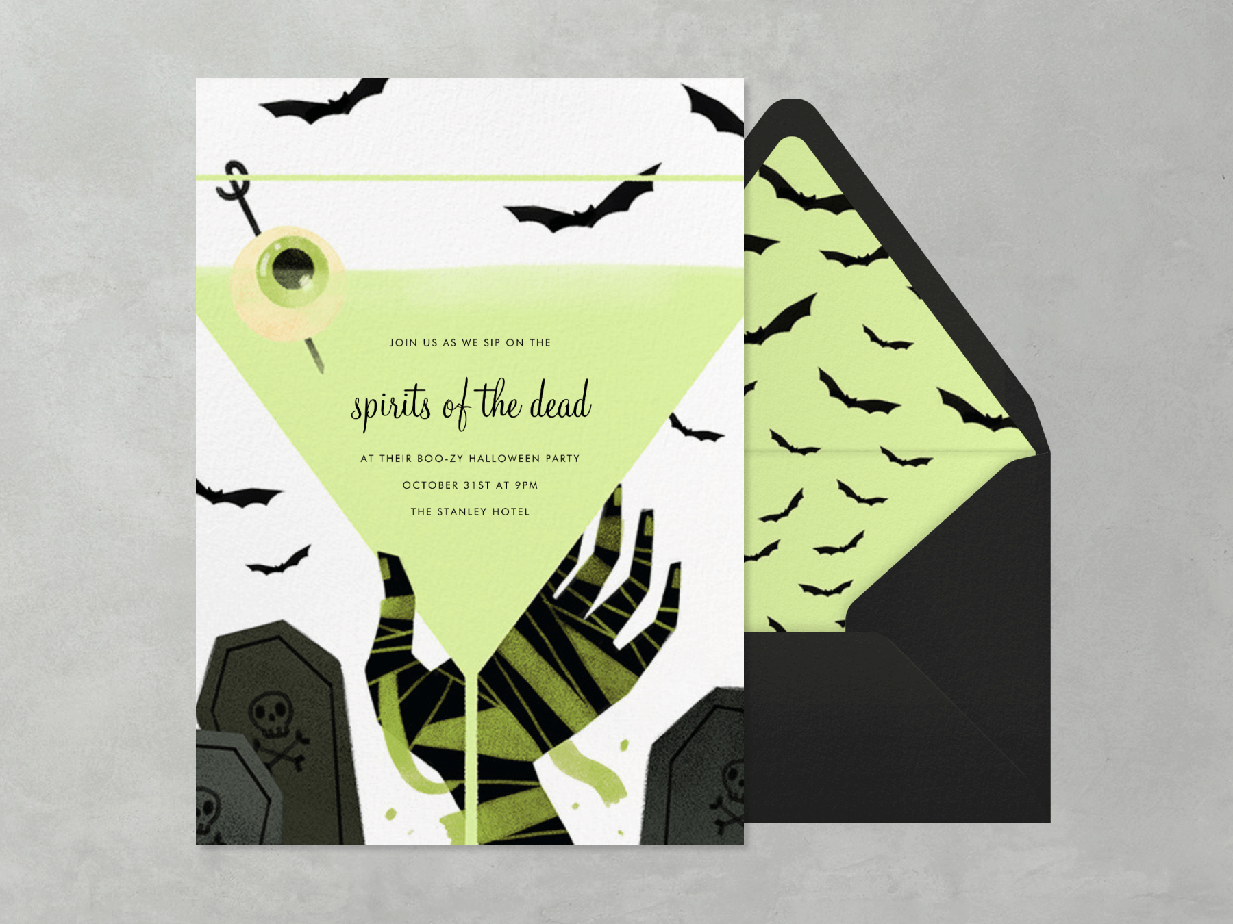 A Halloween invitation featuring a mummy’s hand holding a martini glass with an eyeball garnish.