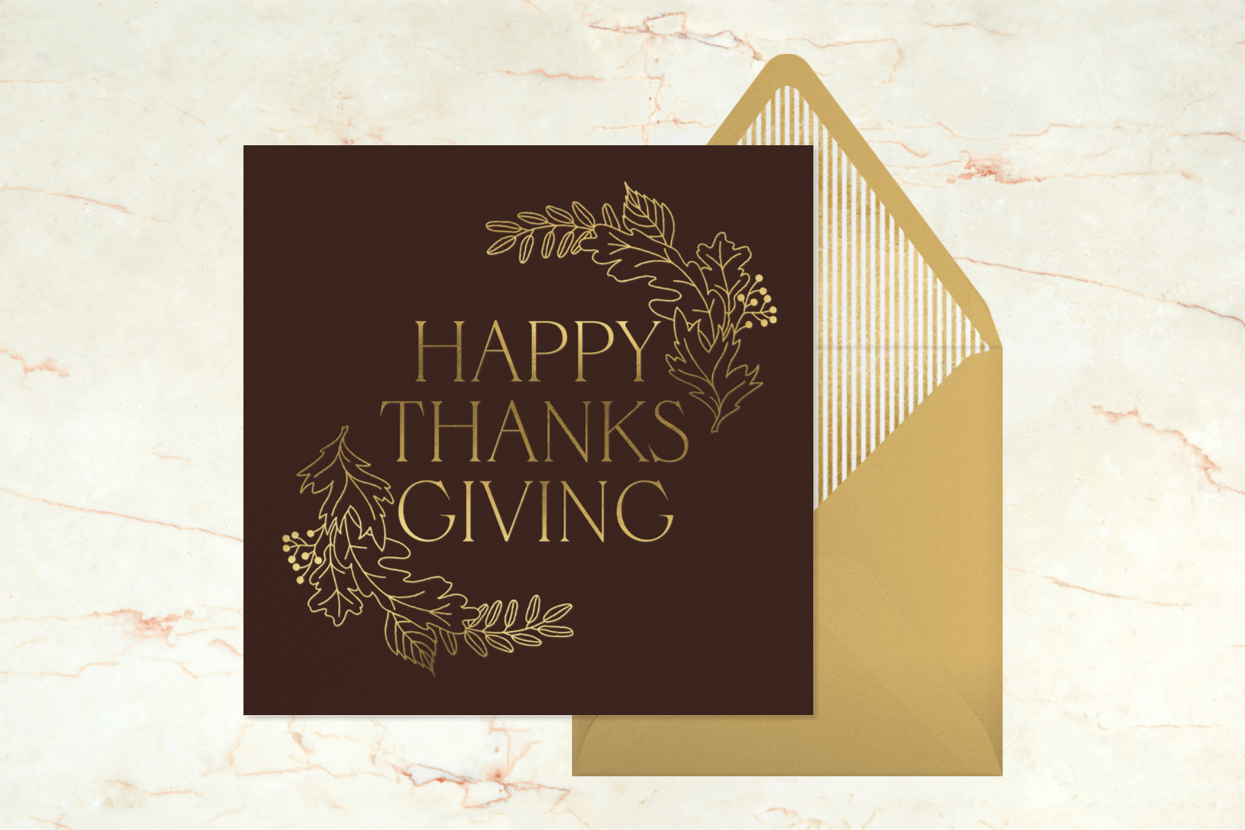 A brown and gold Thanksgiving card with the words “Happy Thanksgiving” and an oak-leaf frame.
