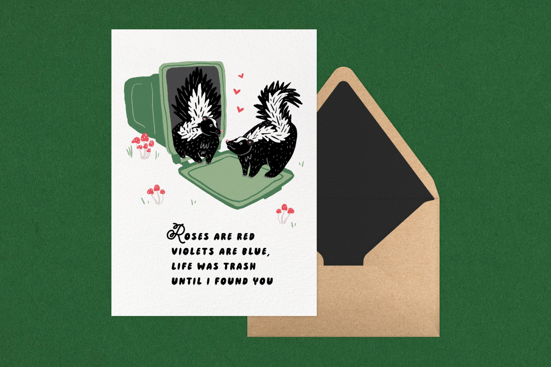 A card with an overturned trashcan and two skunks in love.
