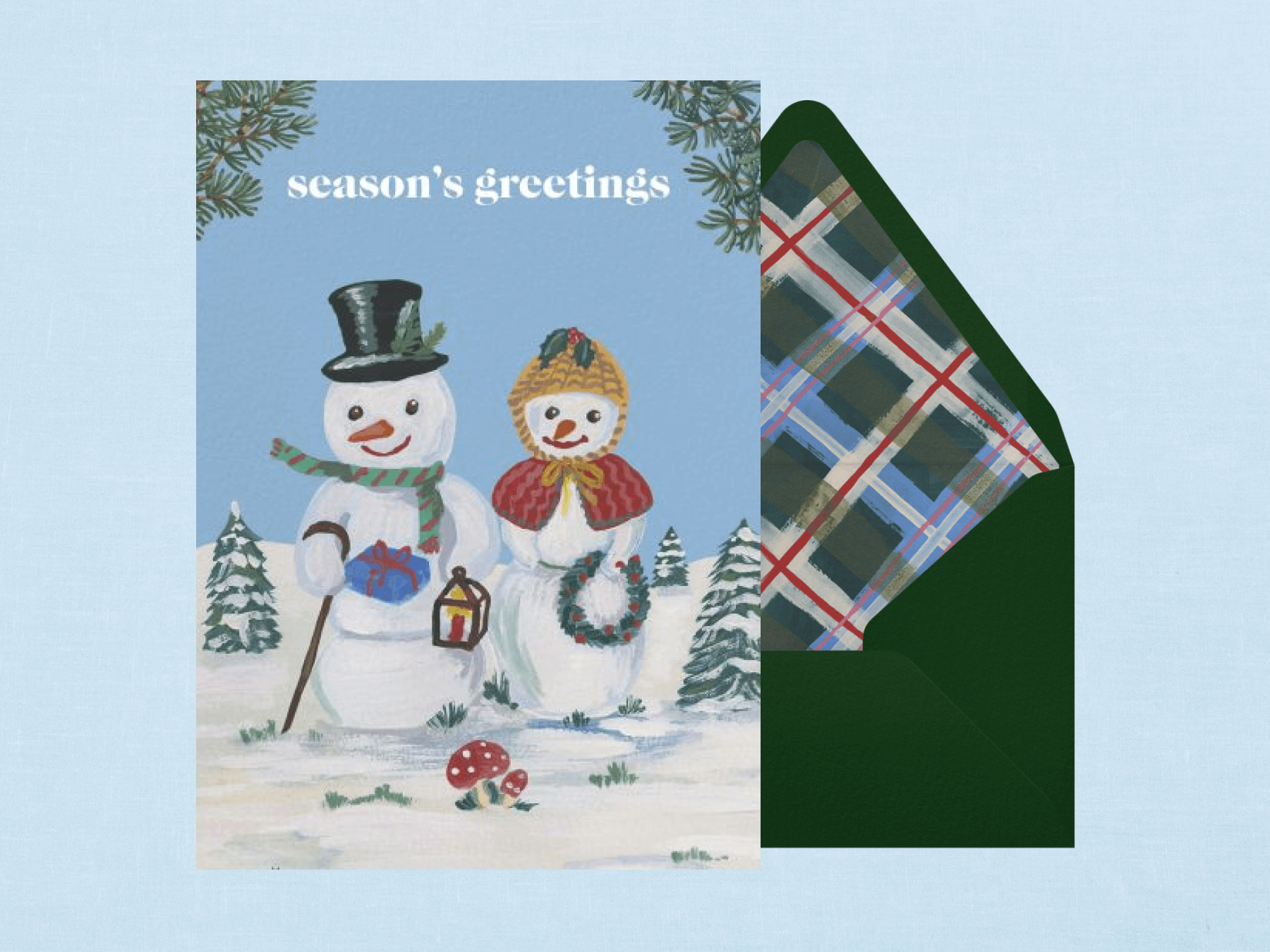 A holiday card with a painting of two snow people wearing winter hats and scarves.