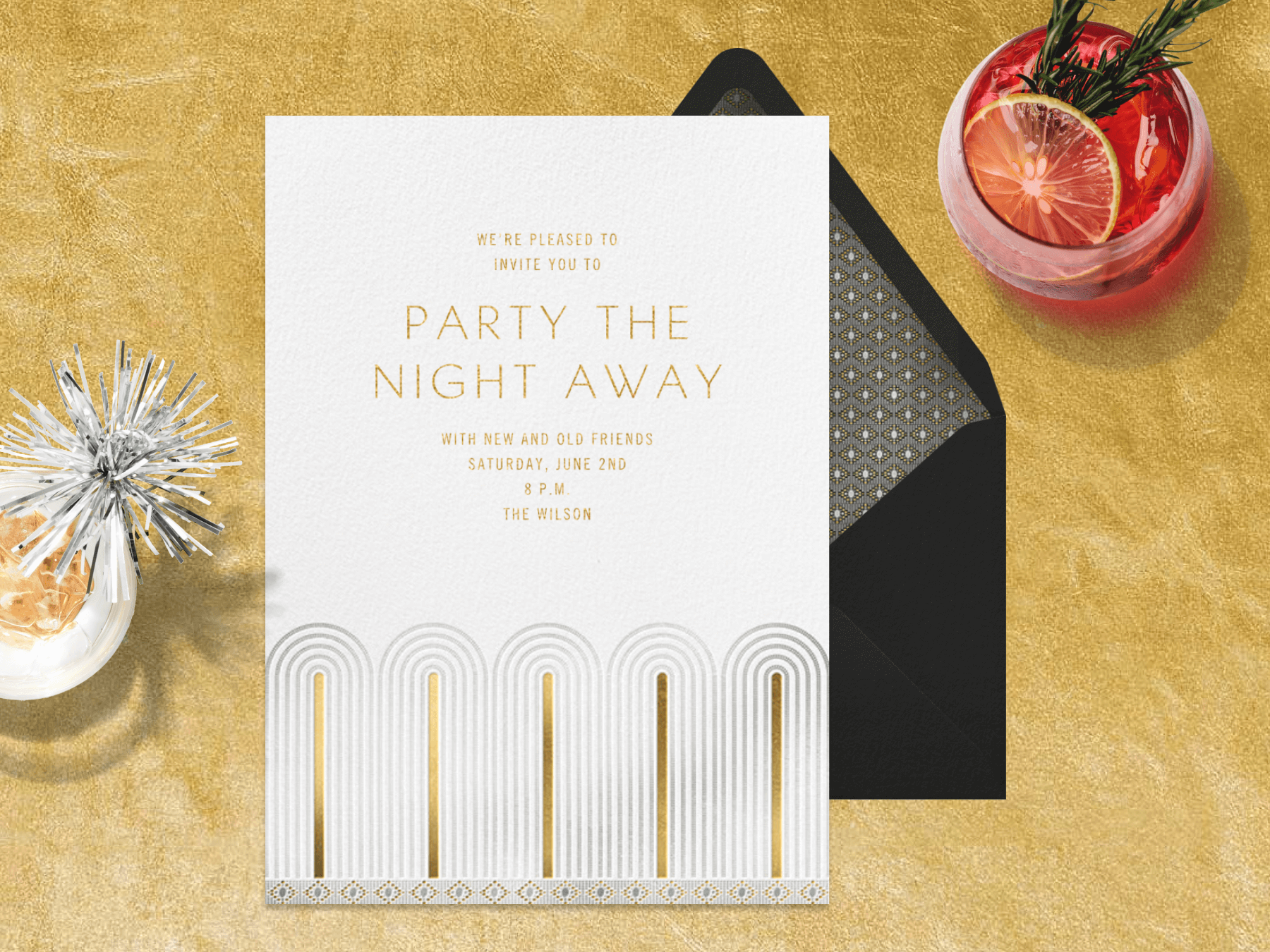 A party invitation with gold Art Deco arches on the bottom on a gold backdrop with two cocktails.