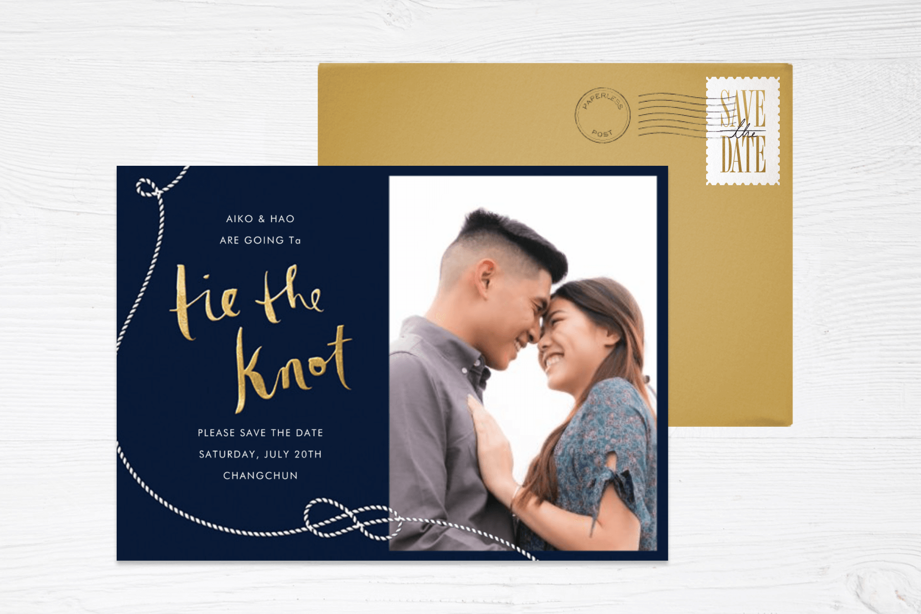 A nautical-themed save the date with a navy background and the phrase “Tie the knot” in gold lettering, plus an illustration of a knotted rope and a photo of a couple smiling at each other.