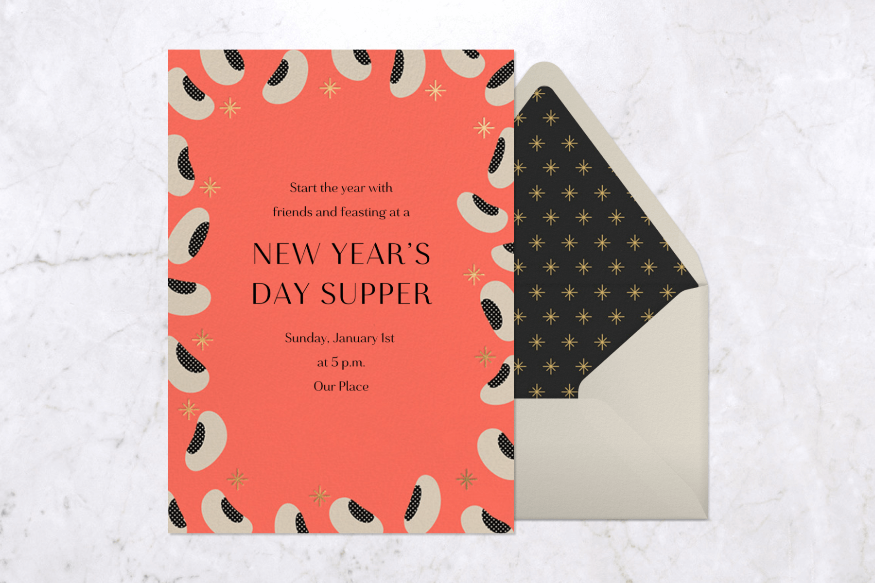 A salmon-colored card with black eyed peas around the border and the words “New Year’s Day Supper.”