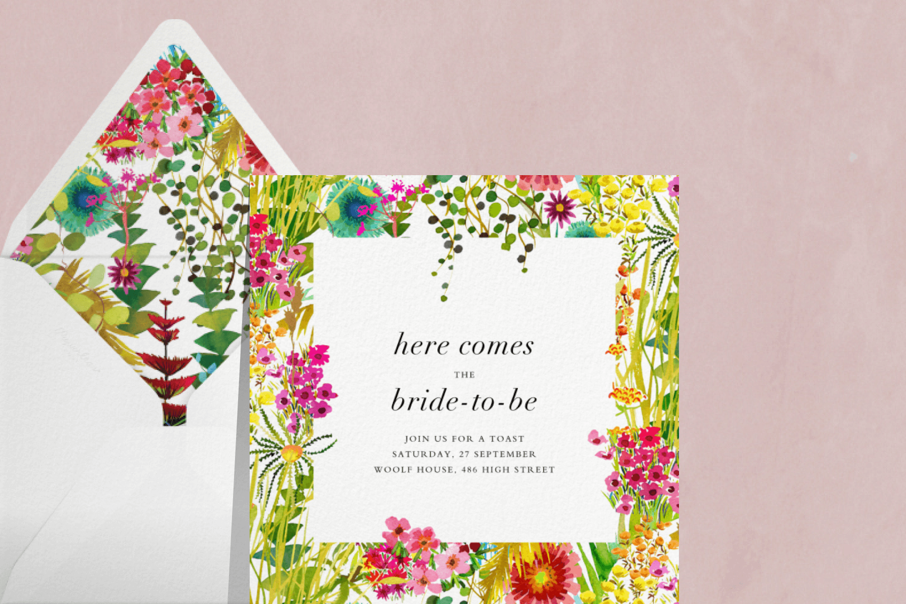 A bridal shower invitation featuring a border of colorful flowers.